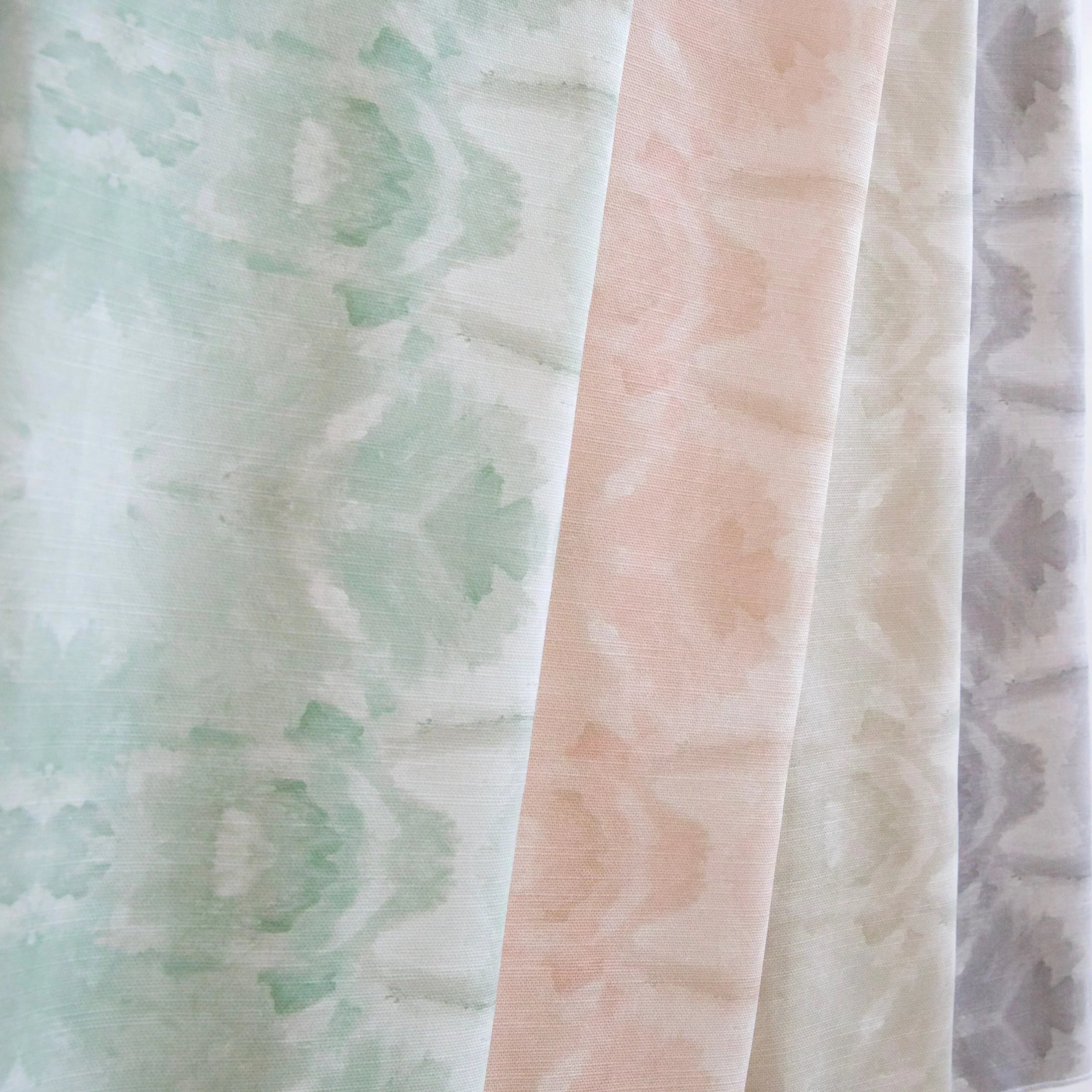 Luxury abstract botanical fabric featuring layered tree-inspired movement in calming jade green and soft neutral tones for collected modern traditional interiors.
