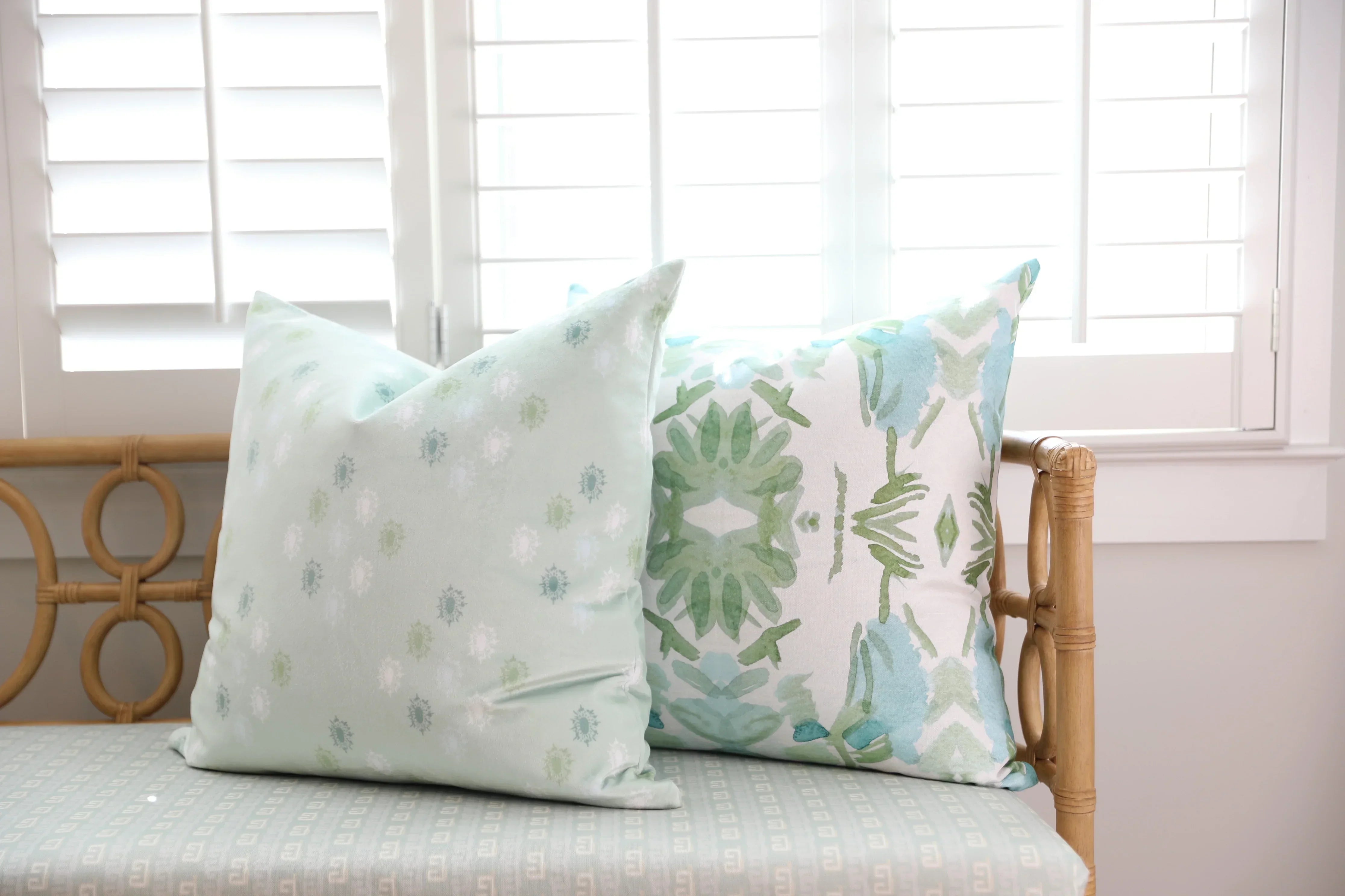 Luxury sage green and blue botanical pillow with large-scale floral pattern inspired by Alaska wildflowers, handcrafted in England and styled for contemporary and traditional interiors.