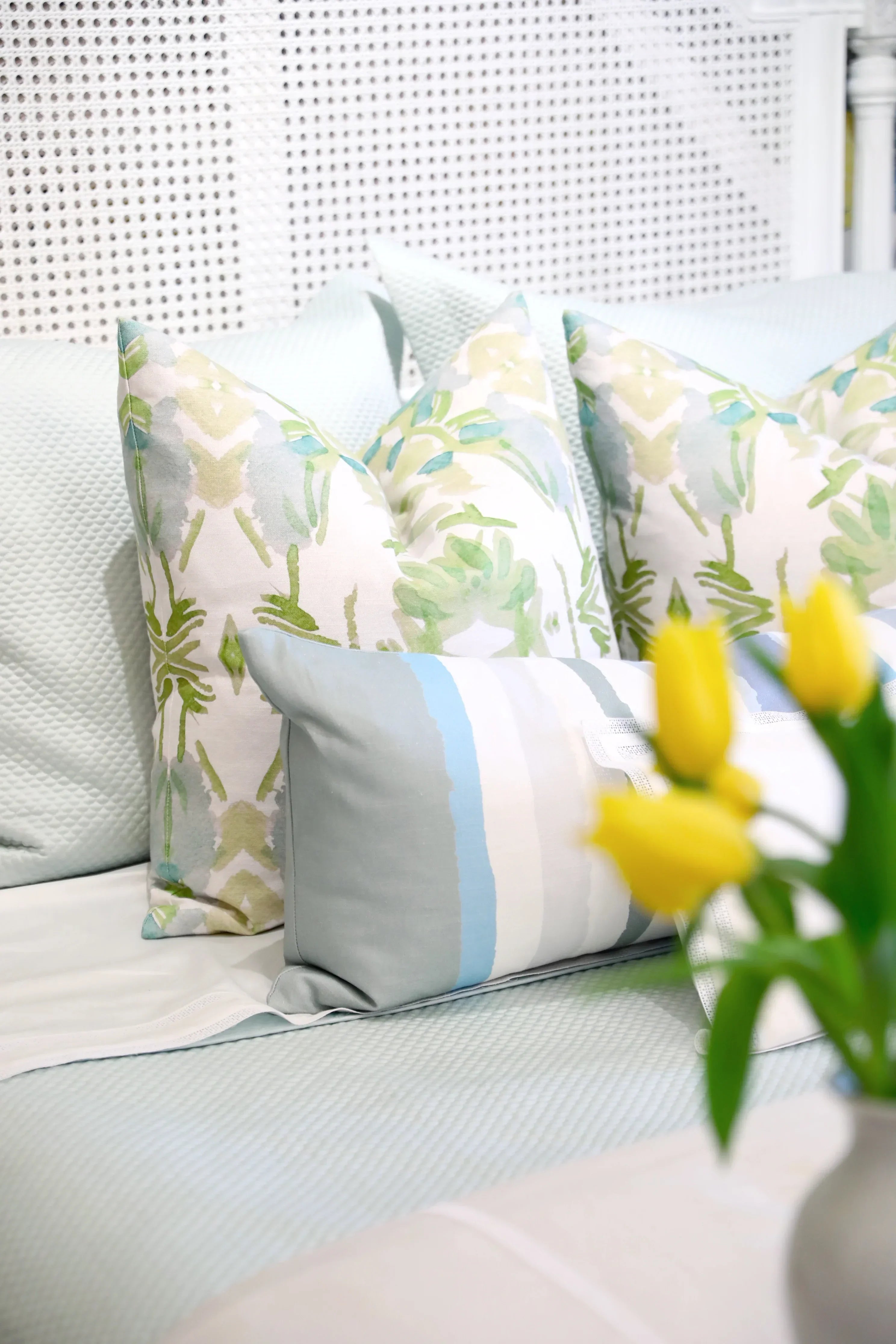 Luxury white and apple green botanical pillow with large-scale floral pattern inspired by Alaska wildflowers, handcrafted in England for contemporary and traditional interiors.