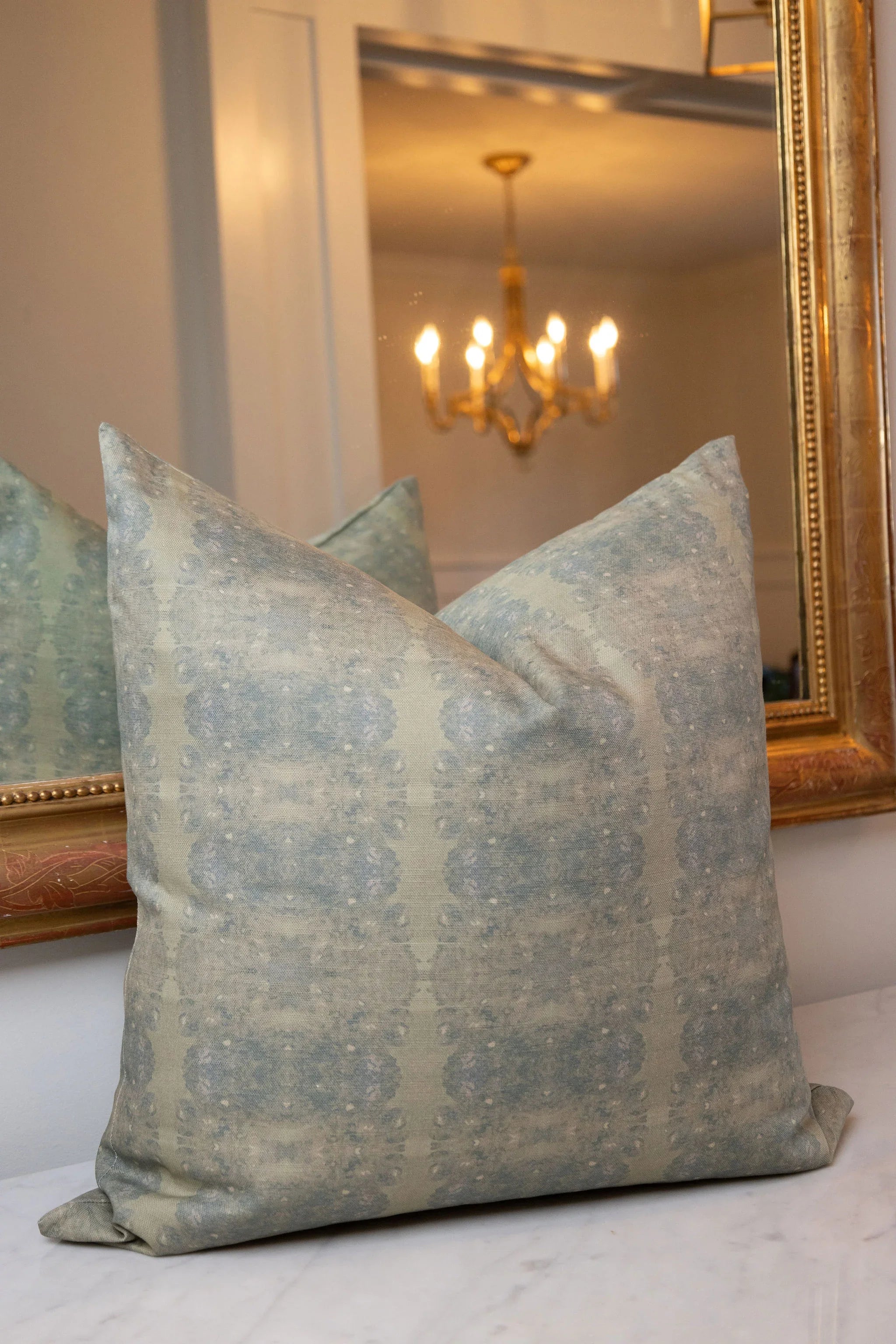 Centerpiece Rosemary luxury pillow featuring an abstract floral pattern in soft green tones, handcrafted in England for layered living rooms, bedrooms, and designer-curated interiors.