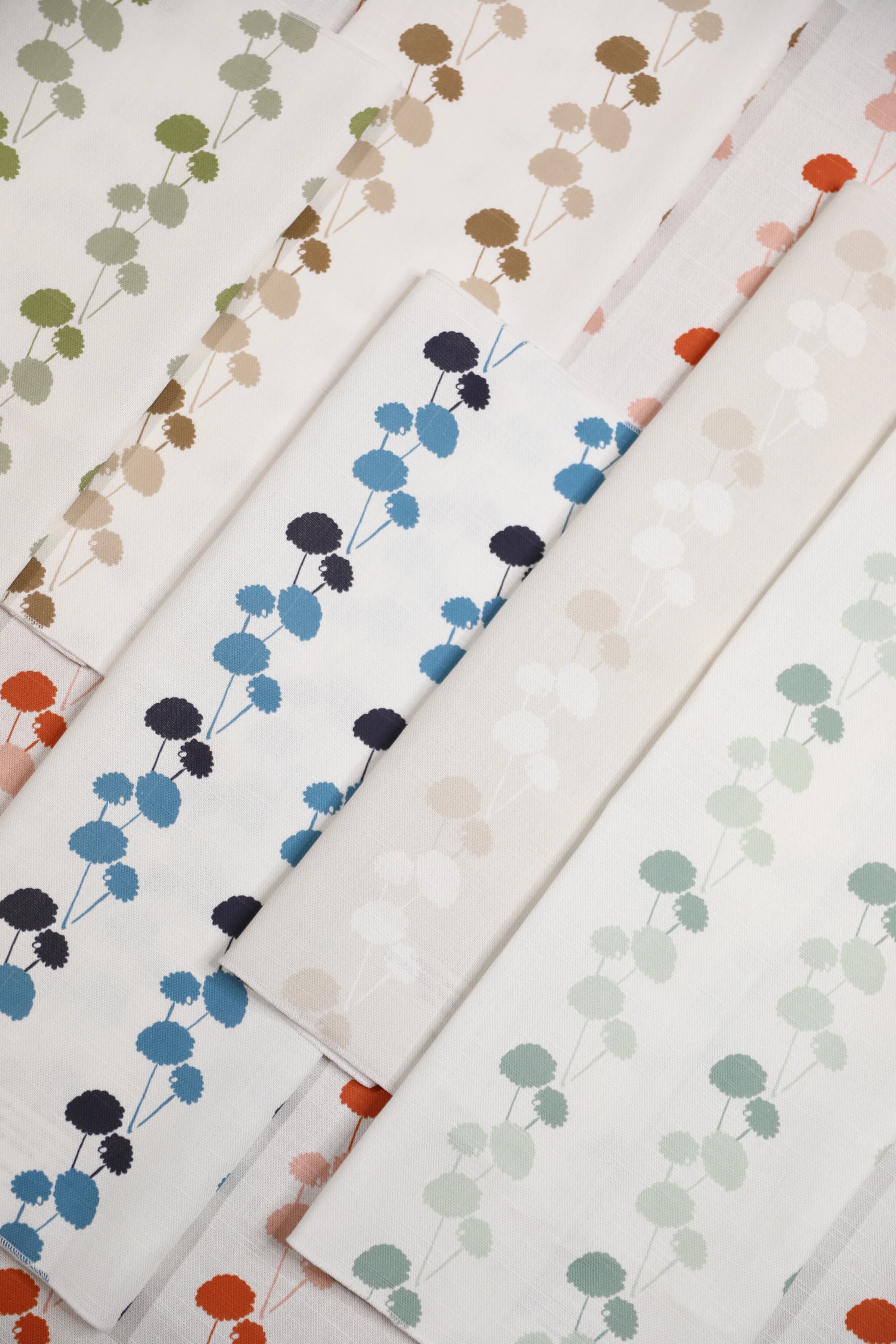 Luxury linear floral fabric with elegant dahlia vine pattern inspired by English gardens, ideal for drapery, upholstery, and refined layered interiors.