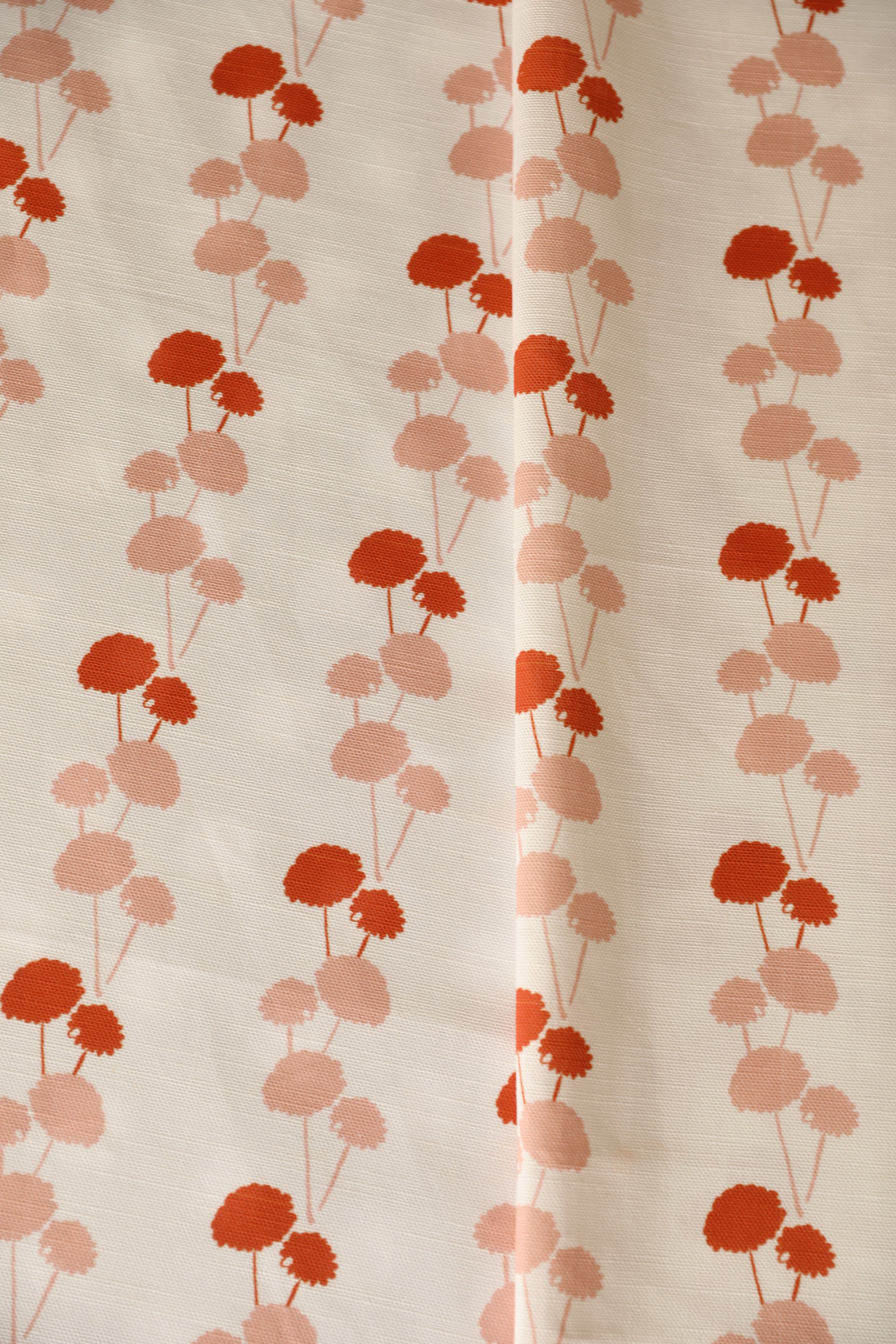 Luxury linear floral fabric with elegant dahlia vine pattern inspired by English gardens, ideal for drapery, upholstery, and refined layered interiors.