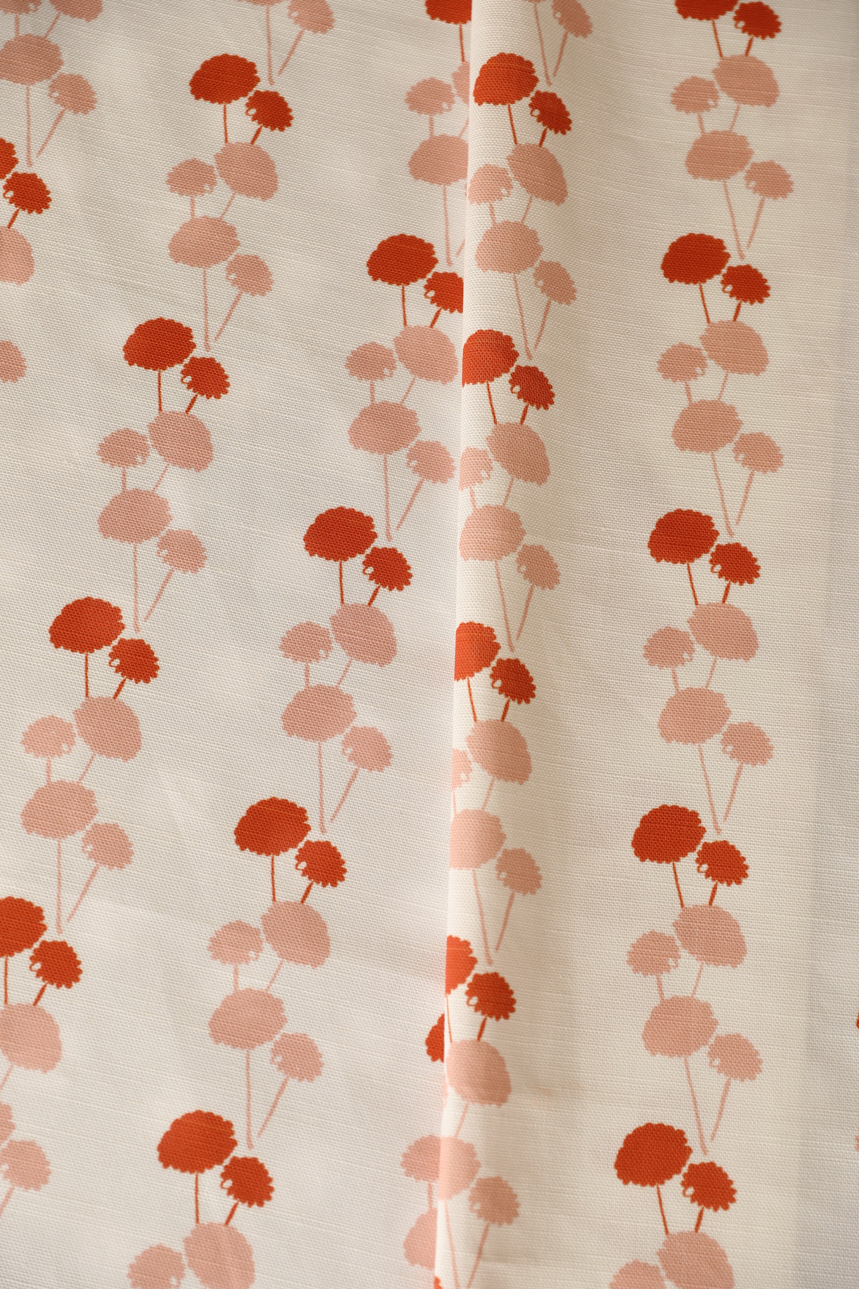 Luxury linear floral fabric with elegant dahlia vine pattern inspired by English gardens, ideal for drapery, upholstery, and refined layered interiors.