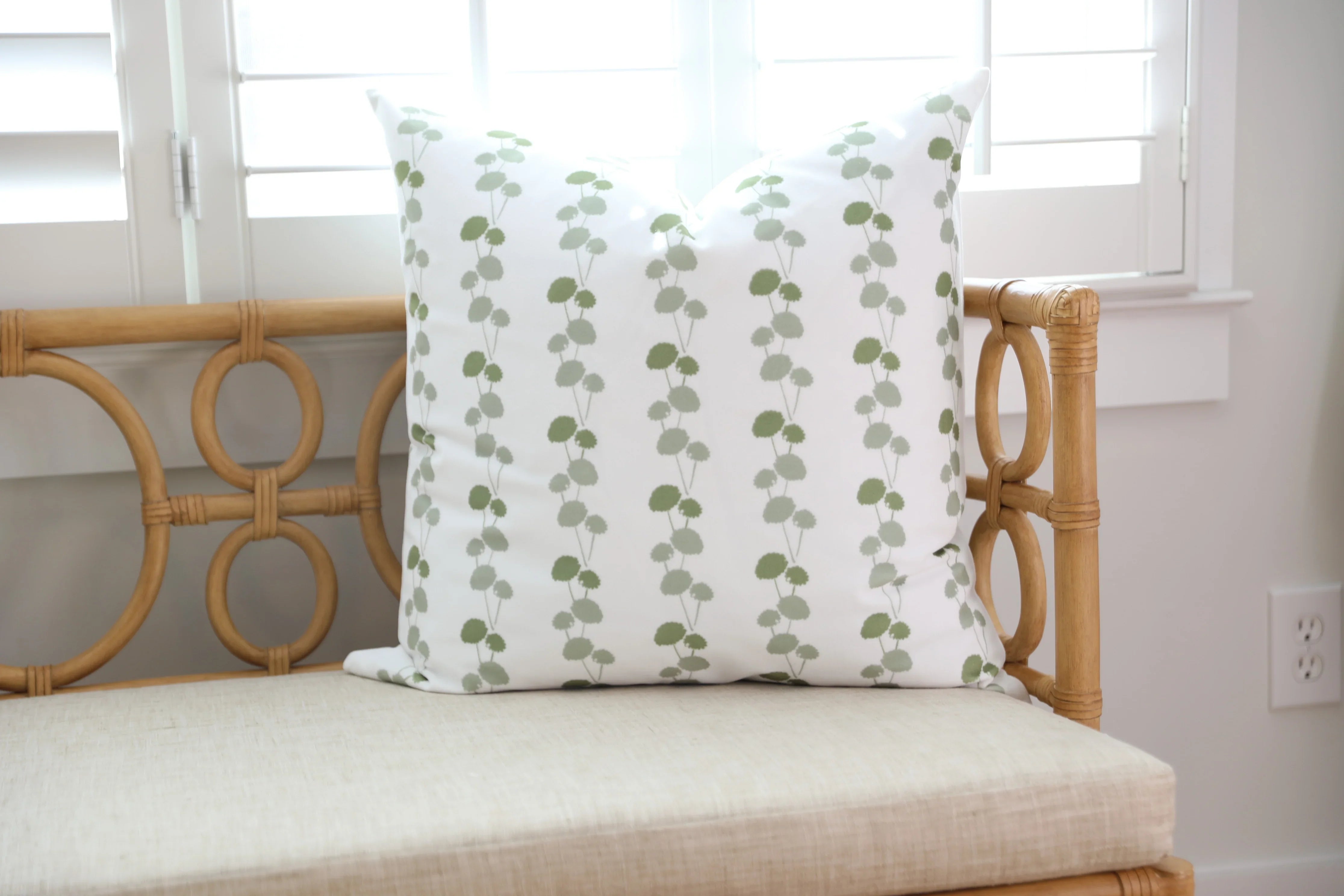 Luxury floral decorative pillow featuring the Dahlia Vine pattern, inspired by blooming dahlias and winding vines, for modern traditional and collected interiors.