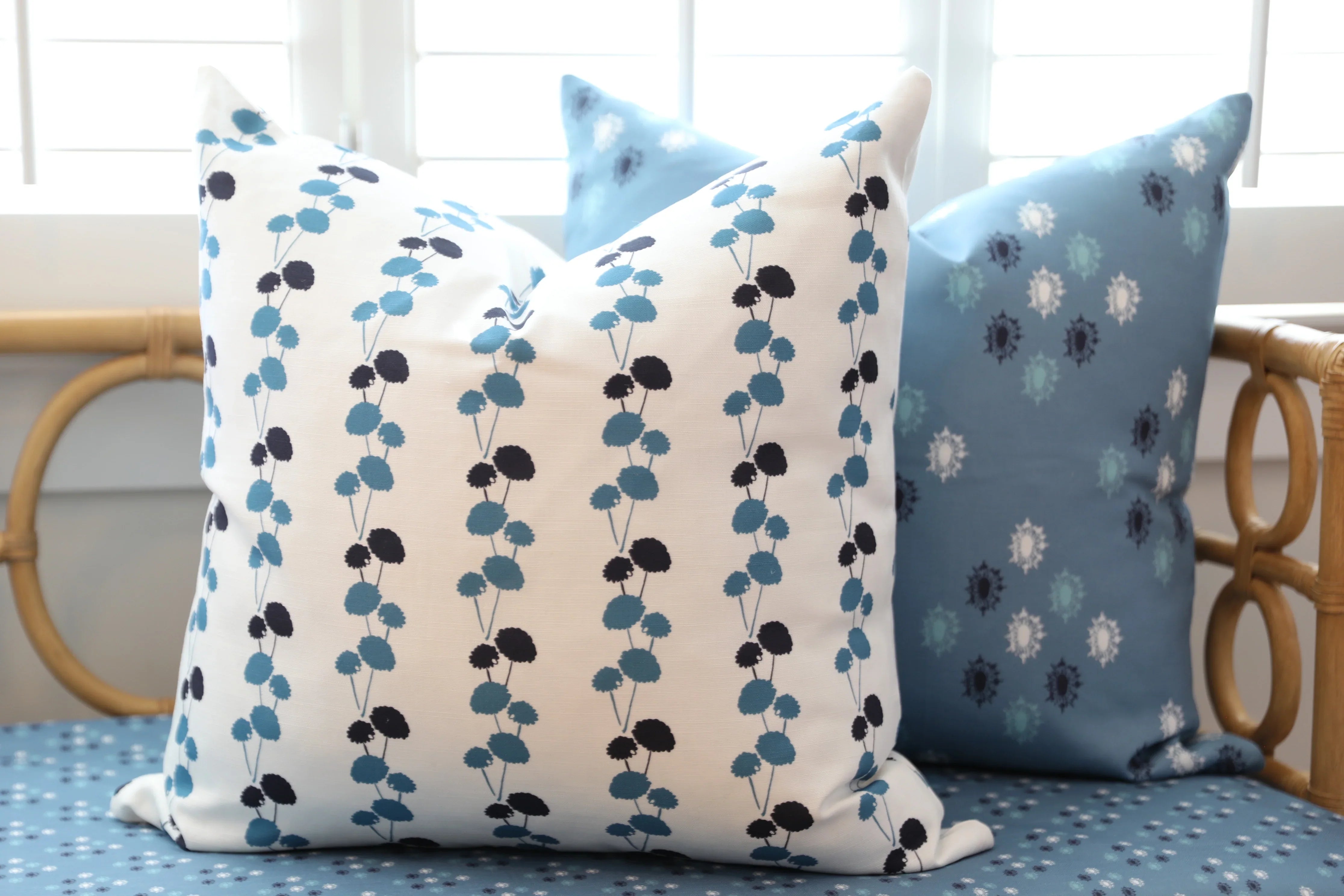 Luxury floral decorative pillow featuring the Dahlia Vine pattern, inspired by blooming dahlias and winding vines, for modern traditional and collected interiors.