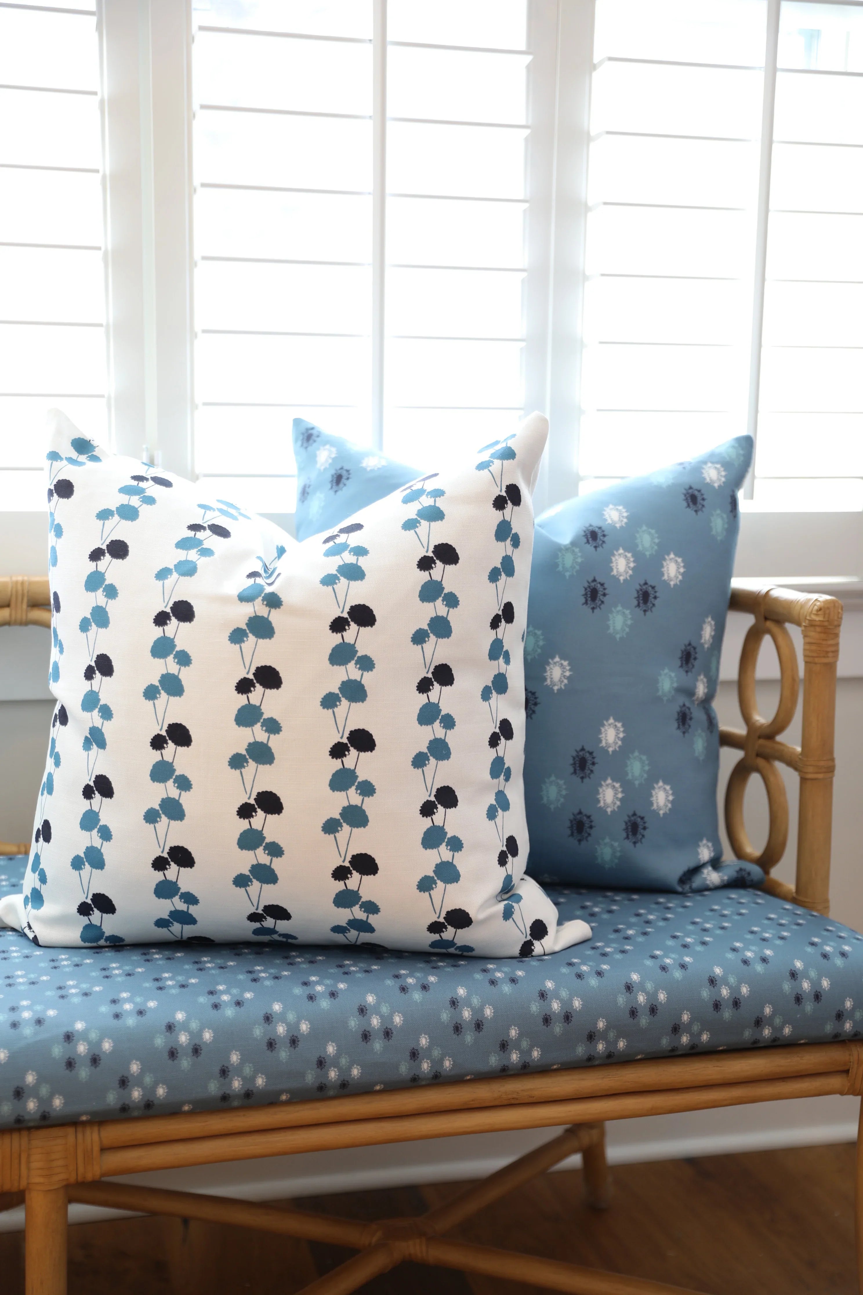 Luxury floral decorative pillow featuring the Dahlia Vine pattern, inspired by blooming dahlias and winding vines, for modern traditional and collected interiors.
