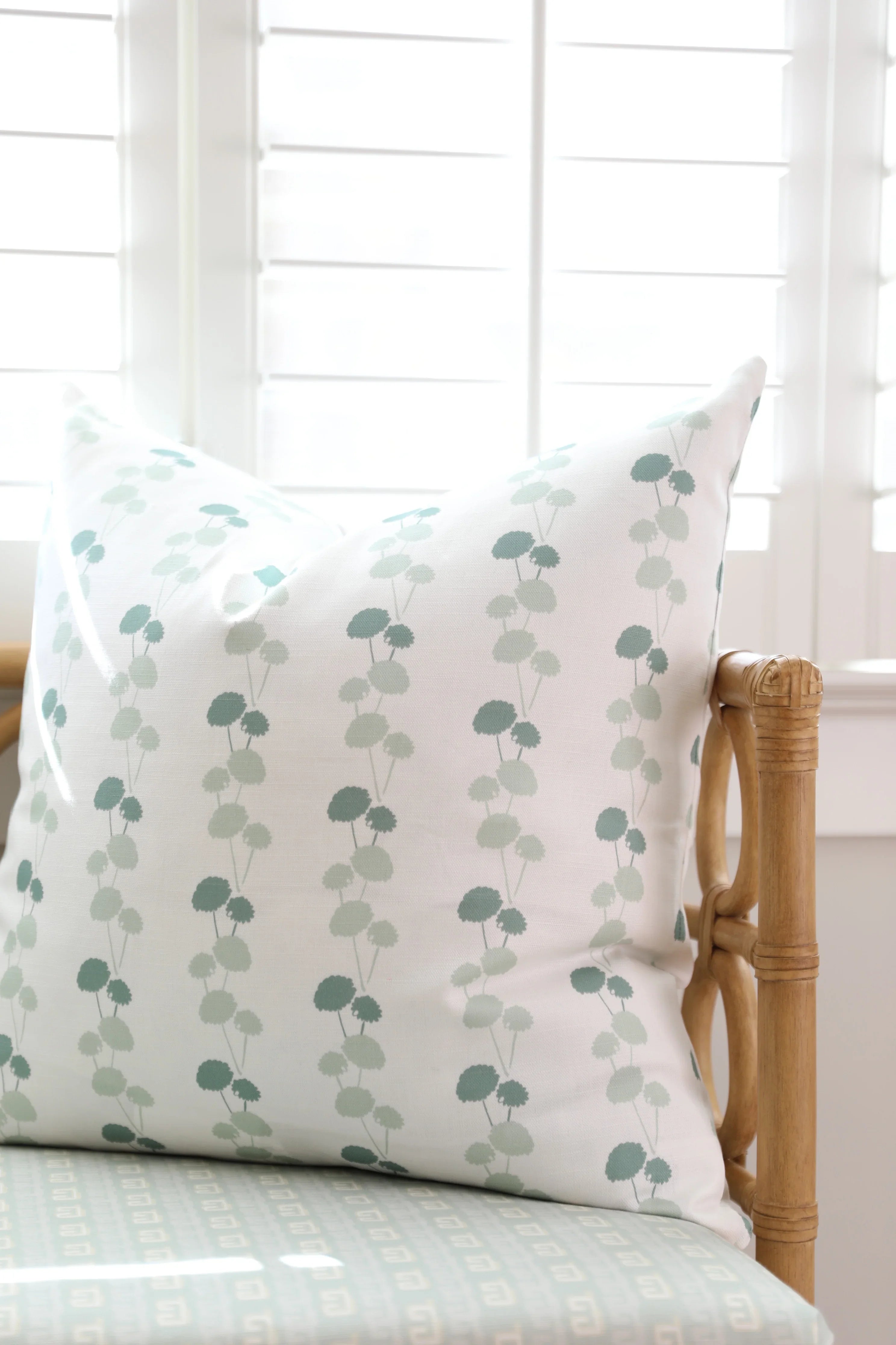 Luxury floral decorative pillow featuring the Dahlia Vine pattern, inspired by blooming dahlias and winding vines, for modern traditional and collected interiors.