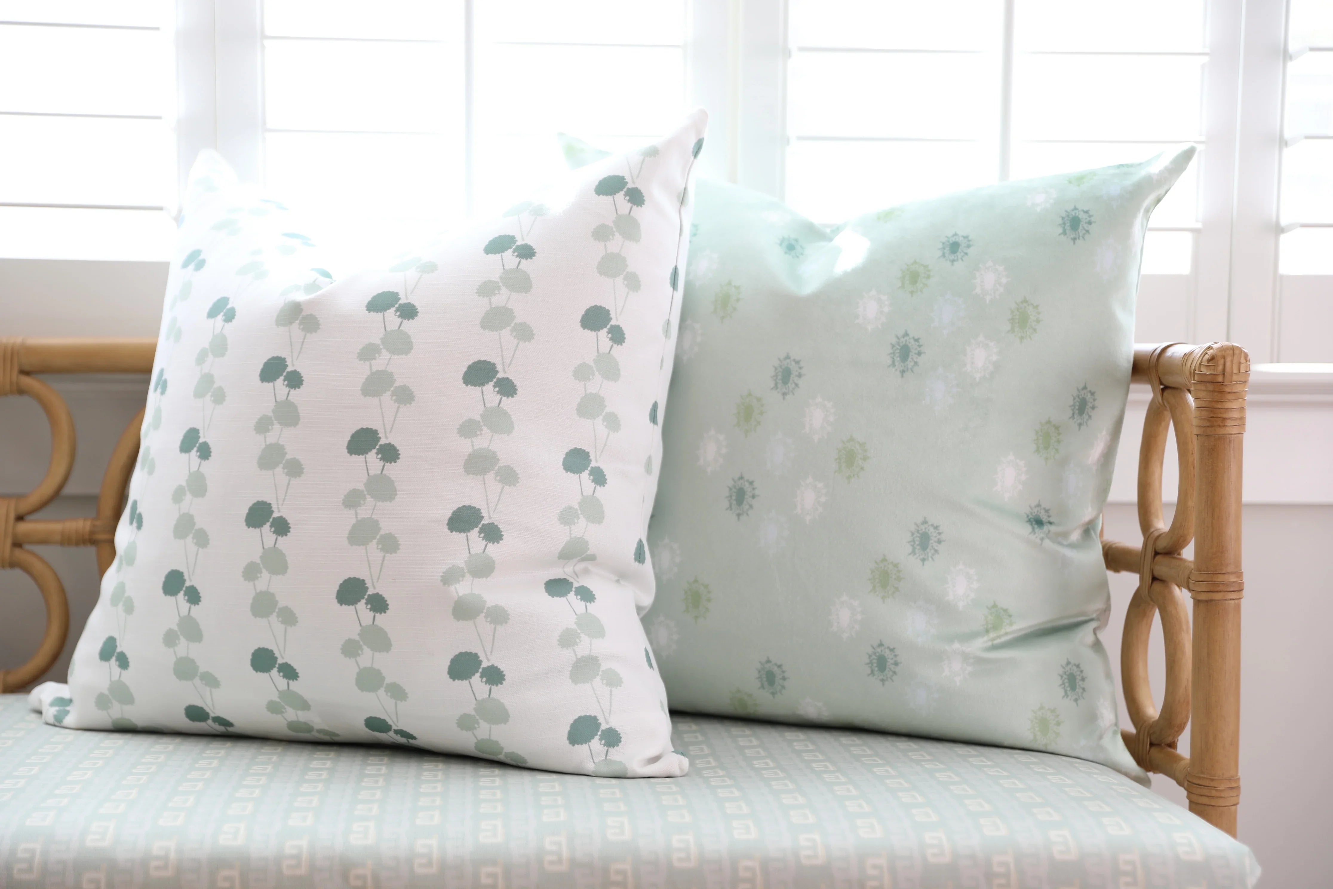Luxury floral decorative pillow featuring the Dahlia Vine pattern, inspired by blooming dahlias and winding vines, for modern traditional and collected interiors.
