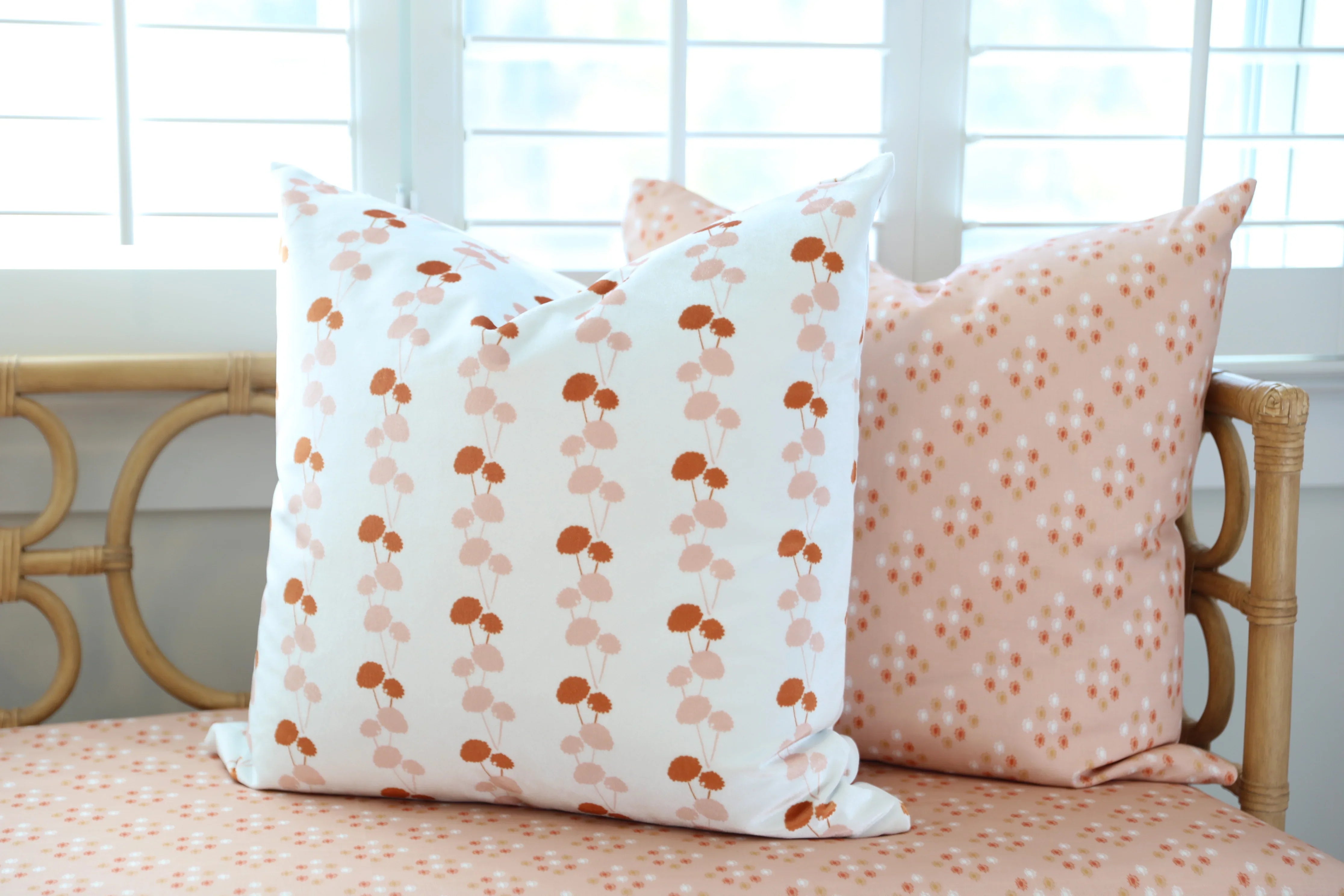 Luxury floral decorative pillow featuring the Dahlia Vine pattern, inspired by blooming dahlias and winding vines, for modern traditional and collected interiors.