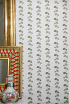 Luxury botanical and floral wallpaper featuring an elegant linear dahlia vine pattern inspired by English gardens, designed for modern traditional interiors, powder rooms, bedrooms, dining spaces, and layered luxury homes. Sustainably printed in England by Truett Designs.
