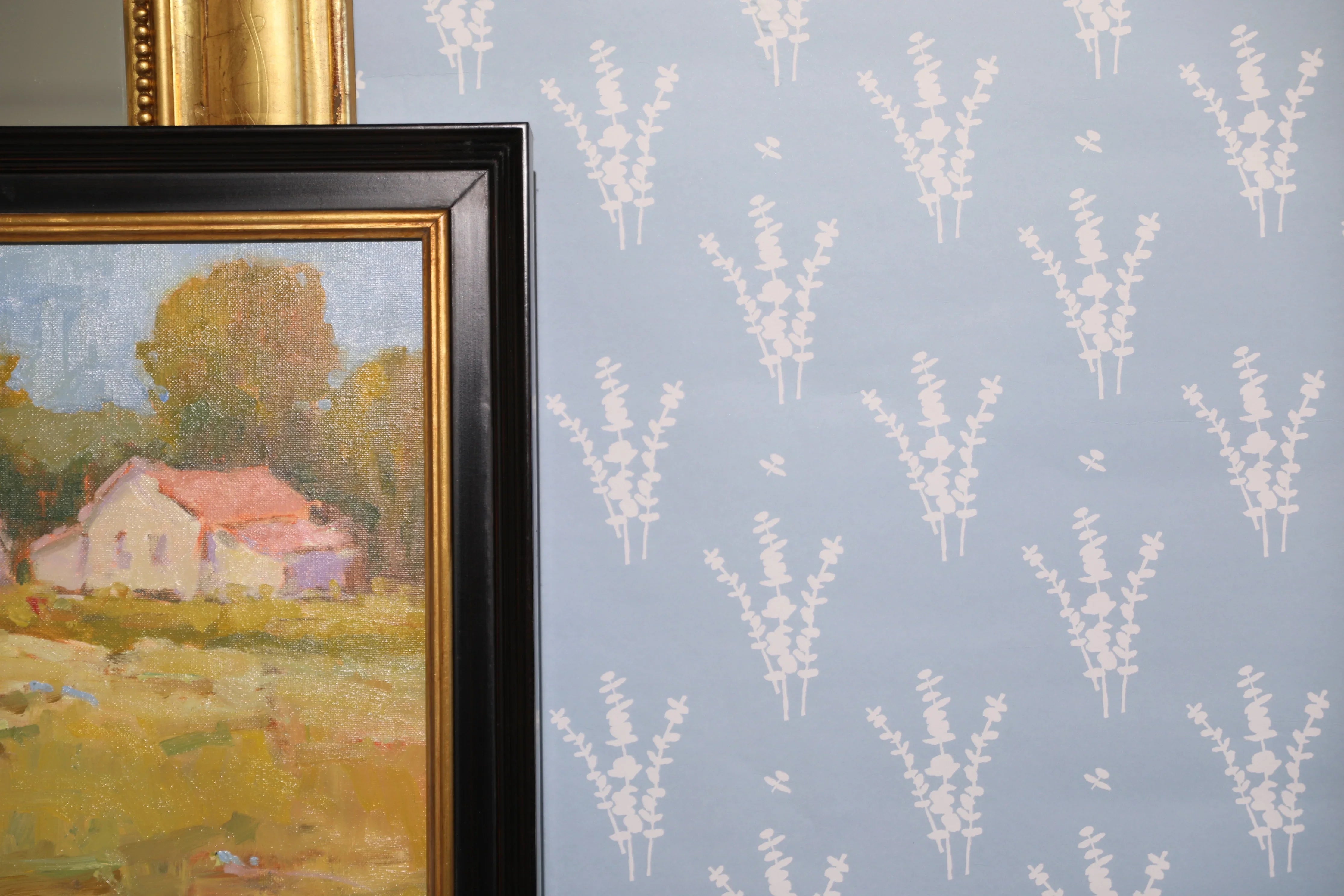 Luxury botanical wallpaper featuring a blue and white eucalyptus pattern, perfect for modern traditional interiors, coastal homes, powder rooms, bedrooms, and collected spaces.