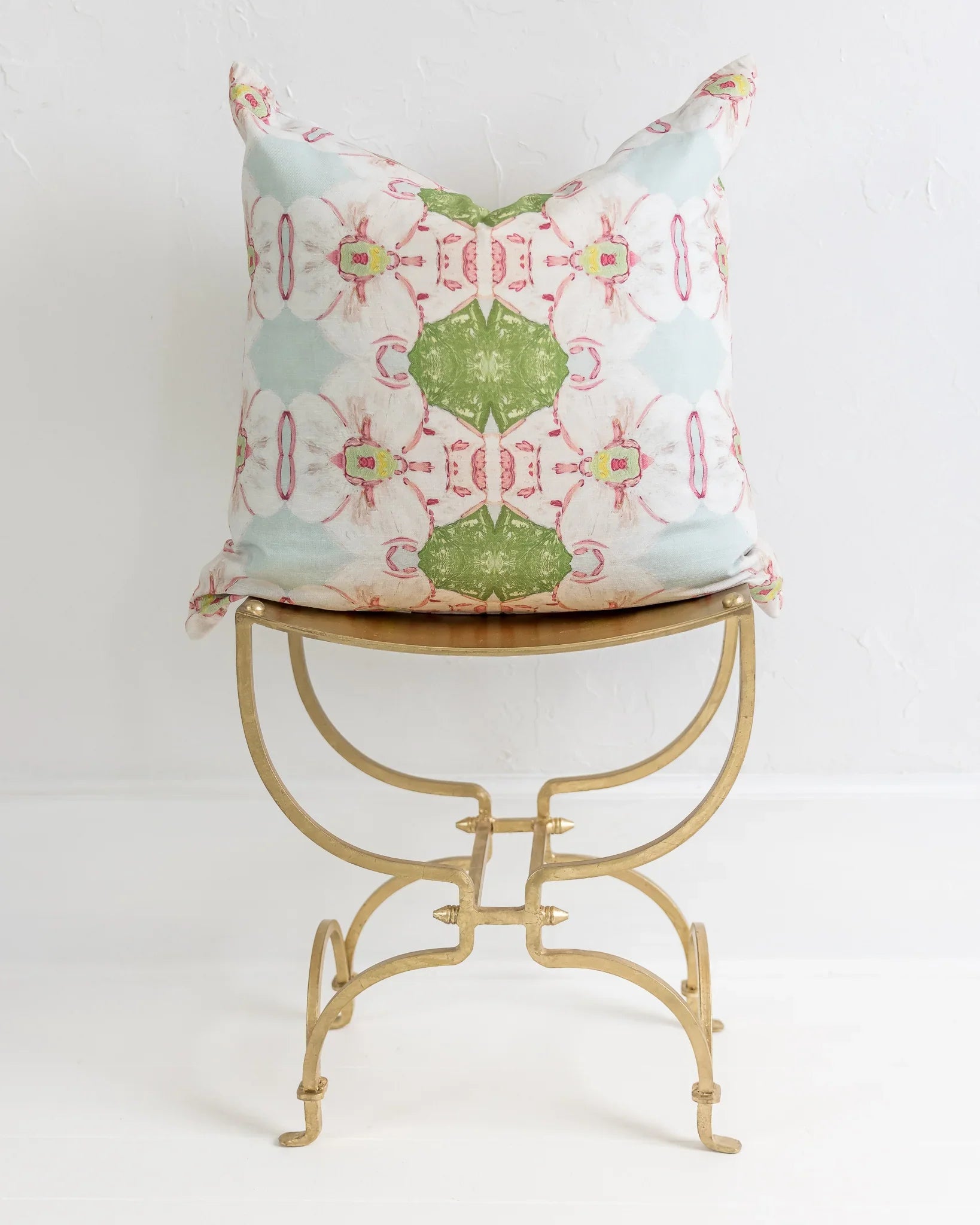 Pink Dogwoods luxury pillow featuring a large-scale abstract floral pattern in pink, soft blue, and grass green tones, handcrafted in England for layered designer interiors and luxury homes.
