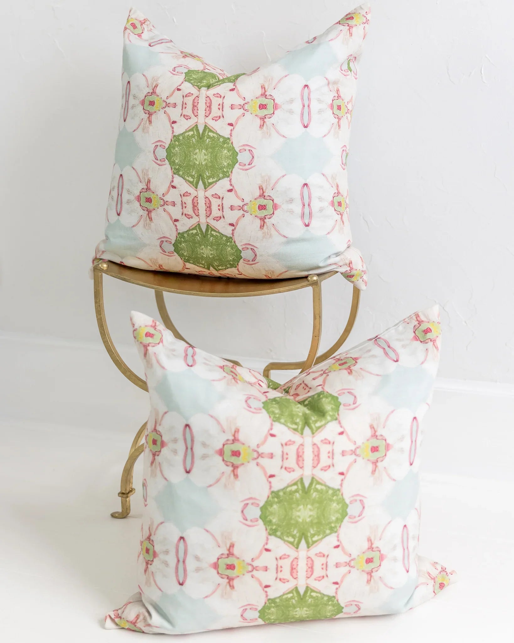 Pink Dogwoods luxury pillow featuring a large-scale abstract floral pattern in pink, soft blue, and grass green tones, handcrafted in England for layered designer interiors and luxury homes.
