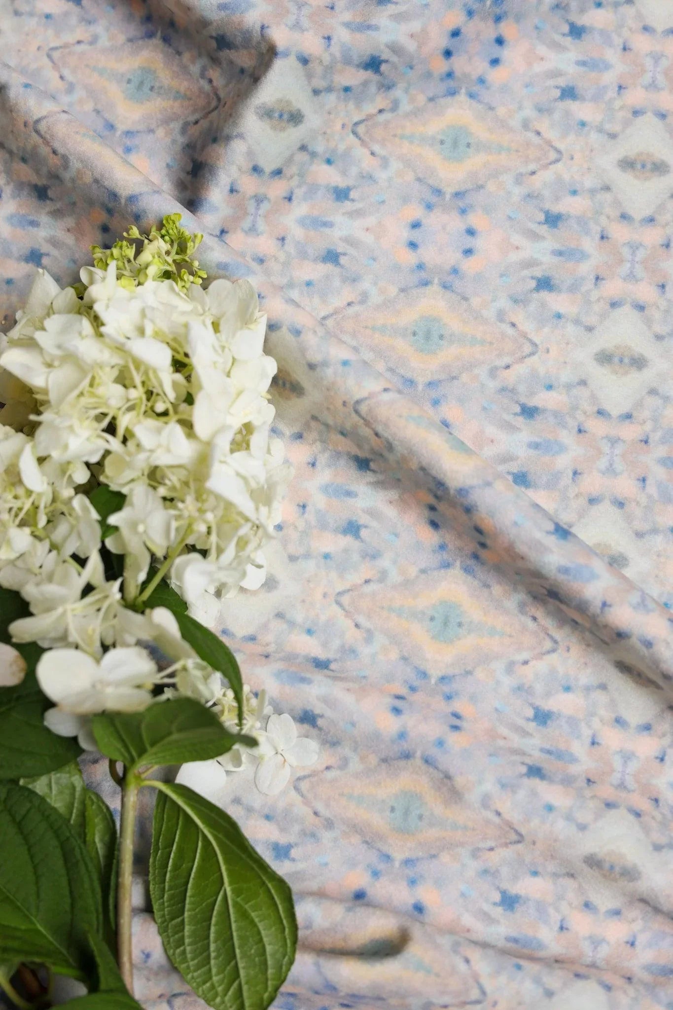 Luxury abstract fabric with layered organic movement inspired by Colorado River rock, designed for upholstery, drapery, bedding, and modern traditional interiors. Small-scale repeat with soft tonal variation and natural texture for collected luxury homes. Sustainably printed and handcrafted in England by Truett