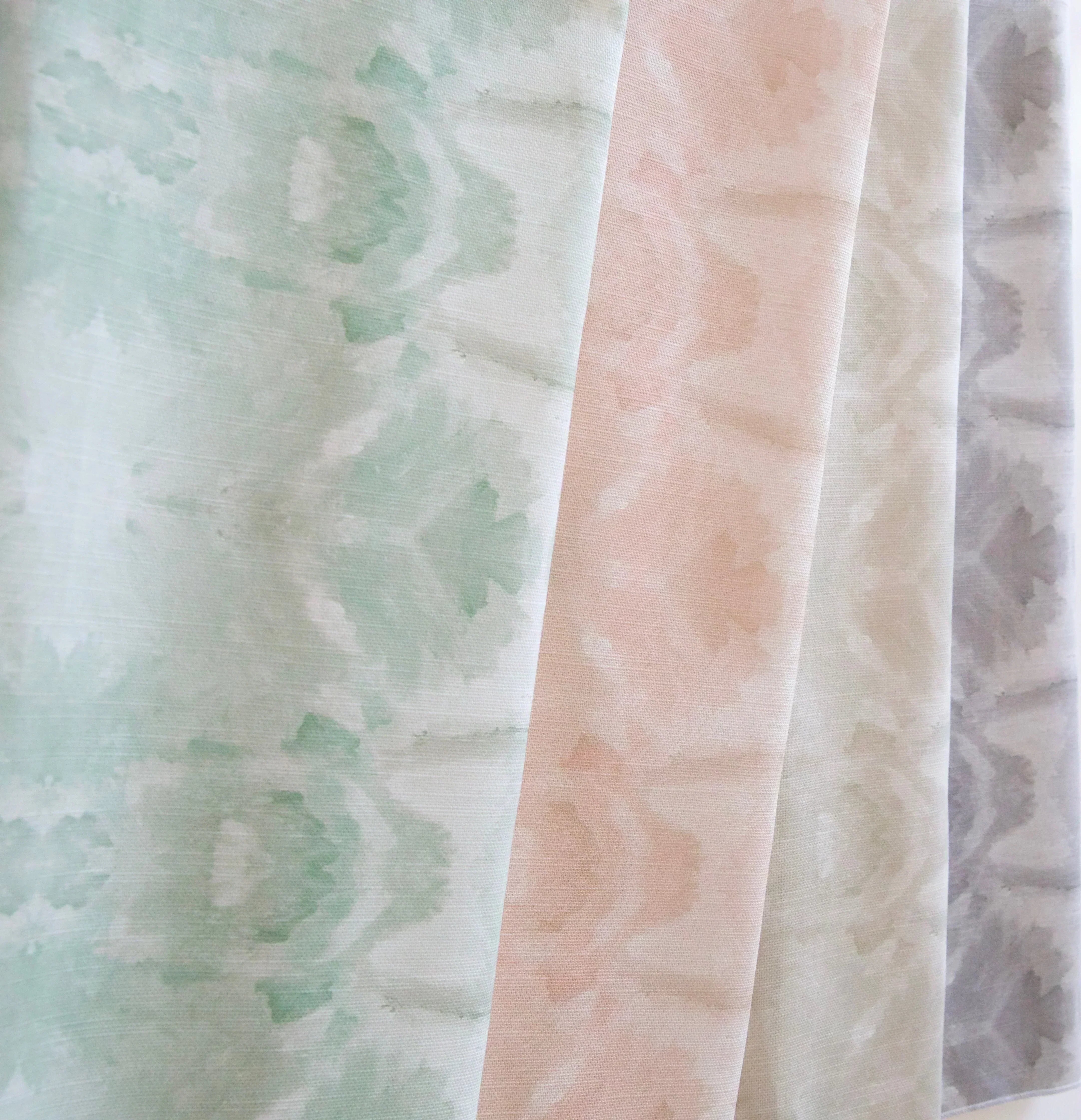 Luxury abstract botanical fabric featuring layered tree-inspired movement in calming jade green and soft neutral tones for collected modern traditional interiors.