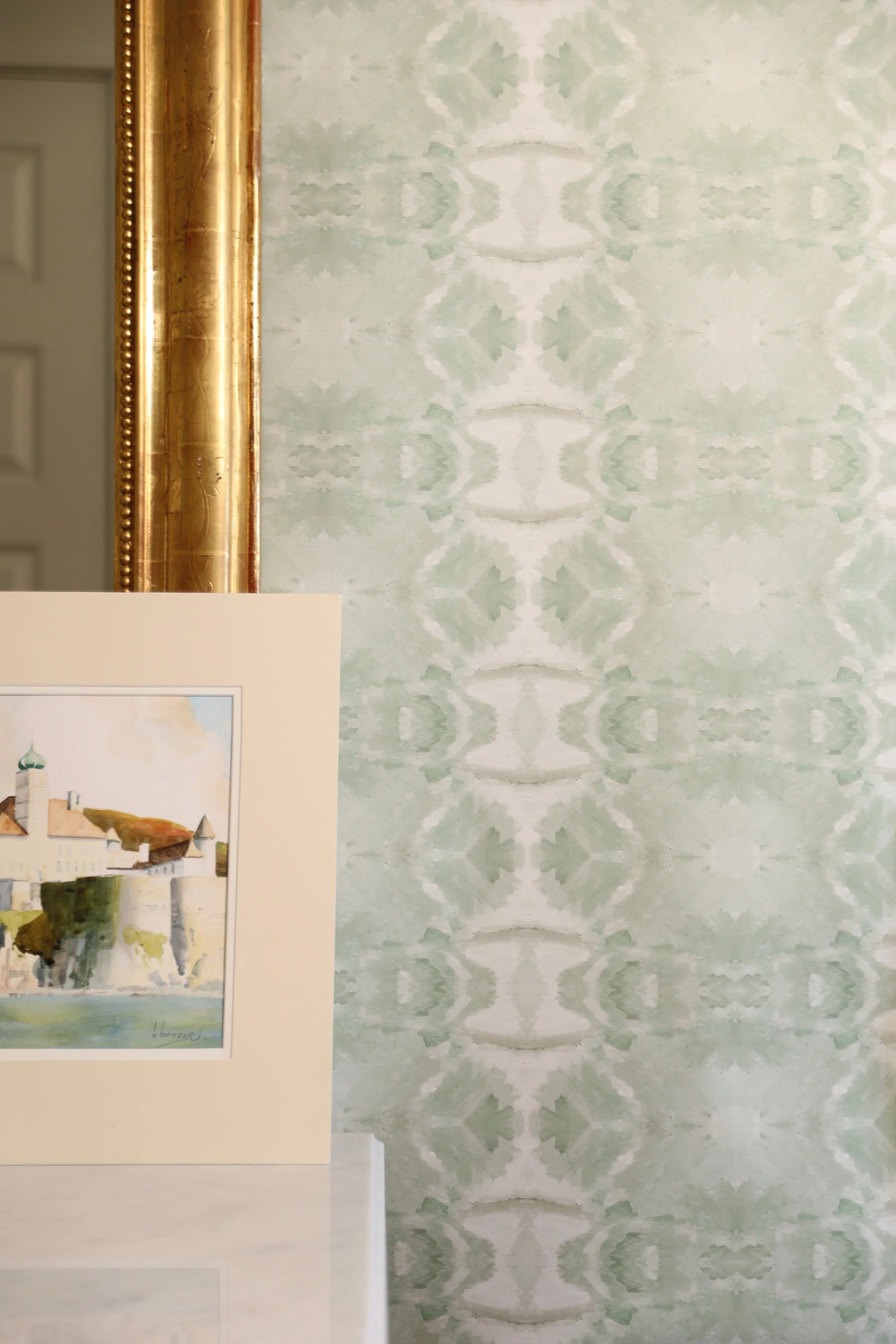 Luxury abstract jade green wallpaper with layered organic movement inspired by live oak trees, ideal for modern traditional interiors, luxury bedrooms, powder rooms, dining spaces, and collected contemporary homes. Sustainably printed in England by Truett Designs.