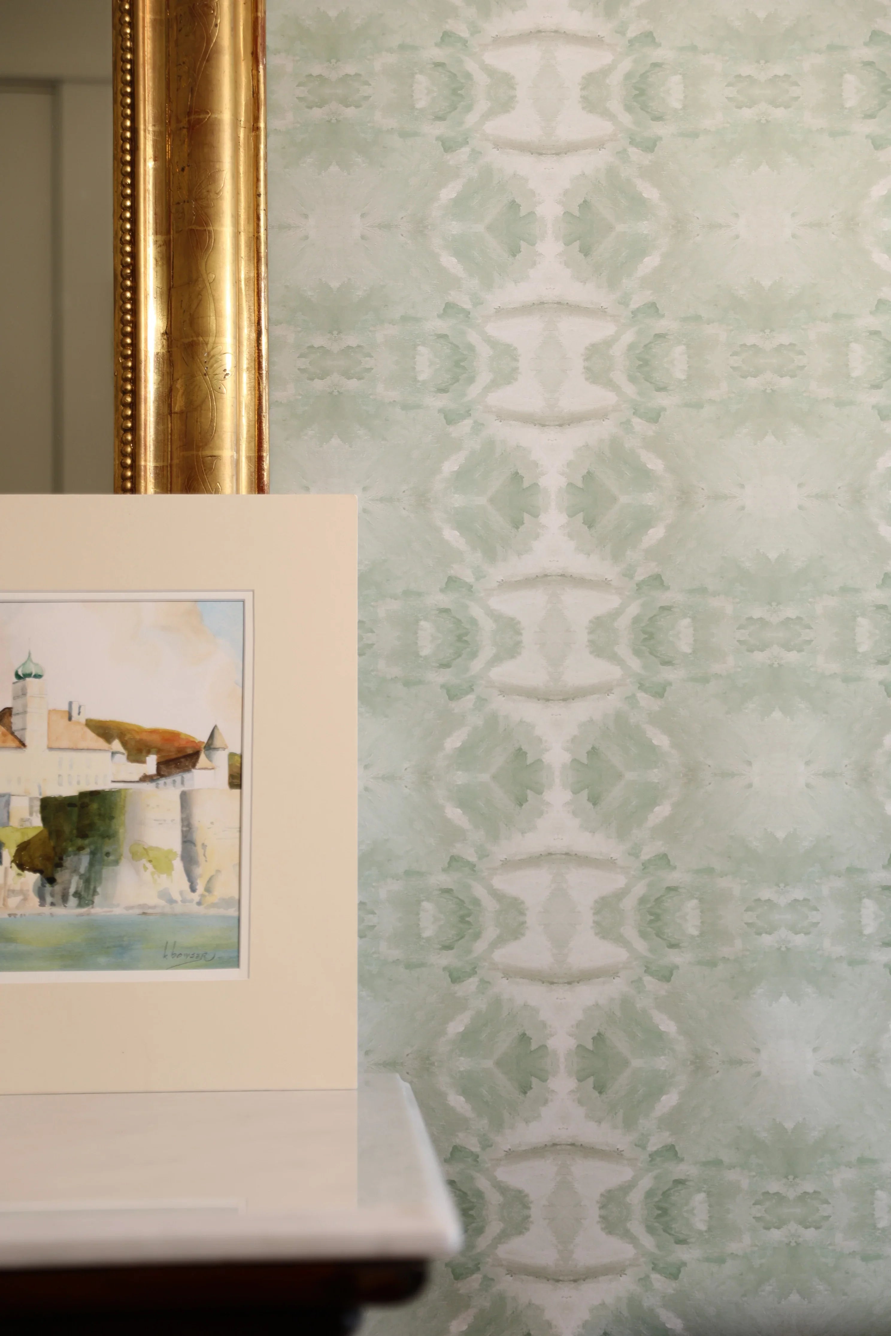 Luxury abstract jade green wallpaper with layered organic movement inspired by live oak trees, ideal for modern traditional interiors, luxury bedrooms, powder rooms, dining spaces, and collected contemporary homes. Sustainably printed in England by Truett Designs.