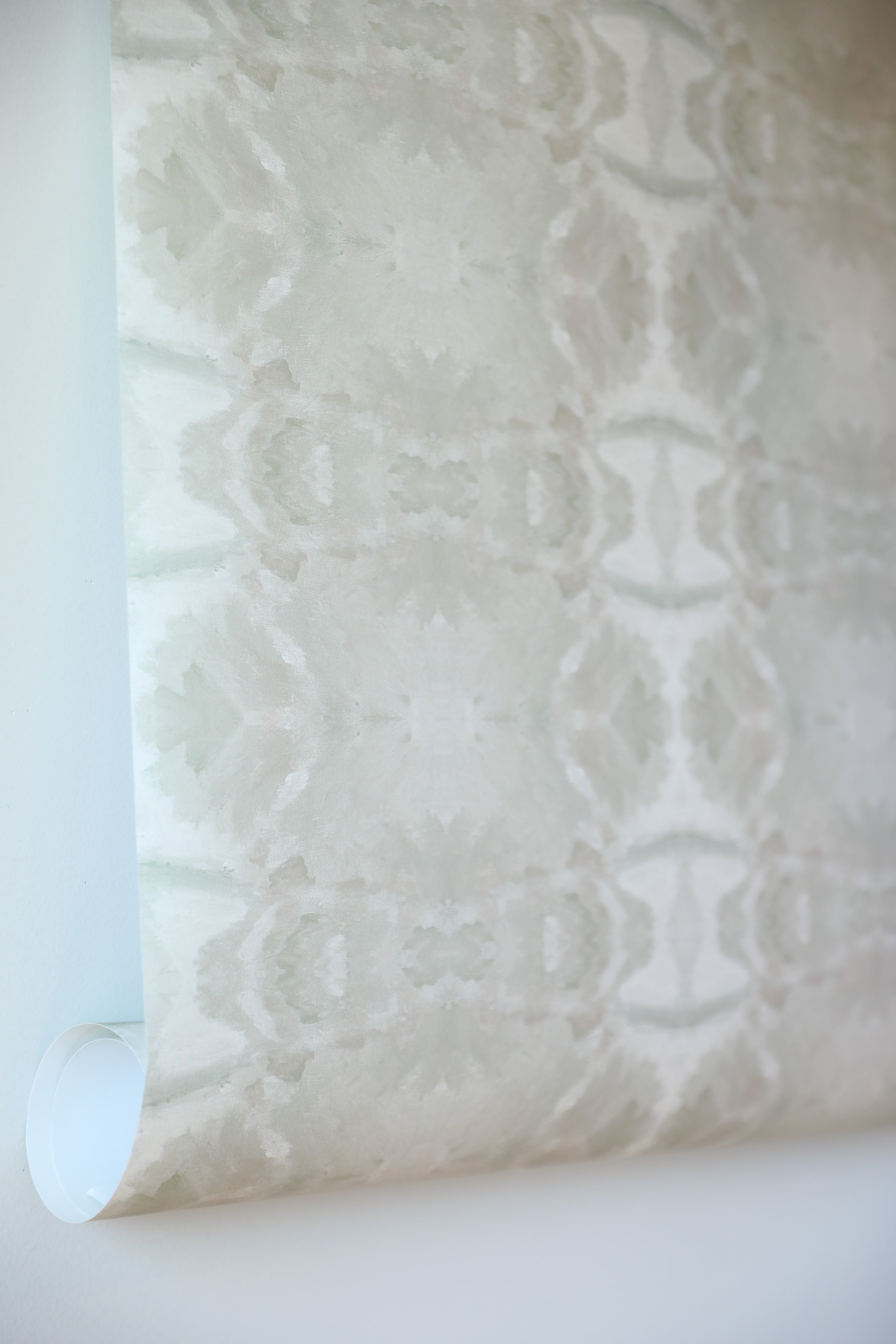 luxury abstract neutral wallpaper in soft putty tones with layered organic movement inspired by live oak trees, designed for modern traditional interiors, luxury bedrooms, powder rooms, dining spaces, and collected contemporary homes. Sustainably printed in England by Truett Designs.