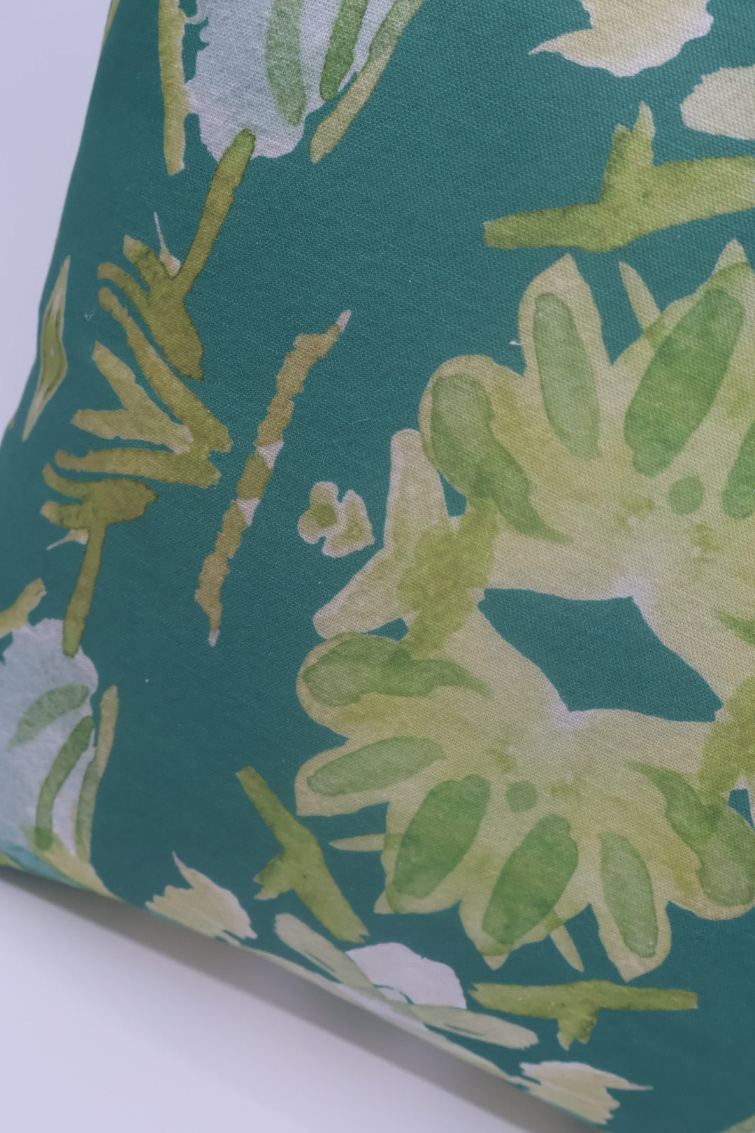 Wildflowers I Dark Green luxury pillow featuring a large-scale abstract floral pattern in rich green tones, handcrafted in England for layered designer interiors, luxury living rooms, and thoughtfully curated home