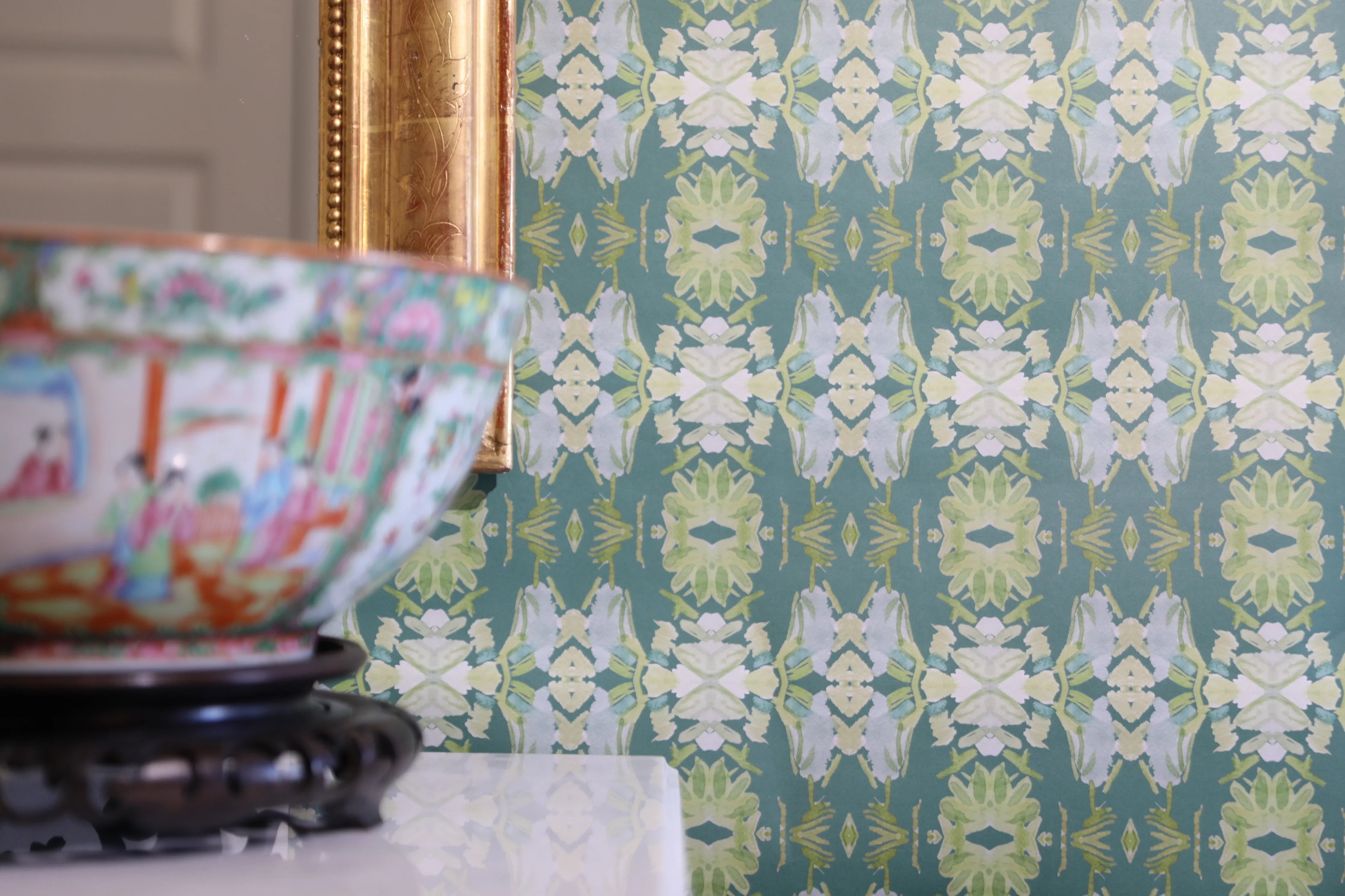 Luxury abstract floral wallpaper in rich dark green tones with layered organic movement, designed for modern traditional and collected interiors.