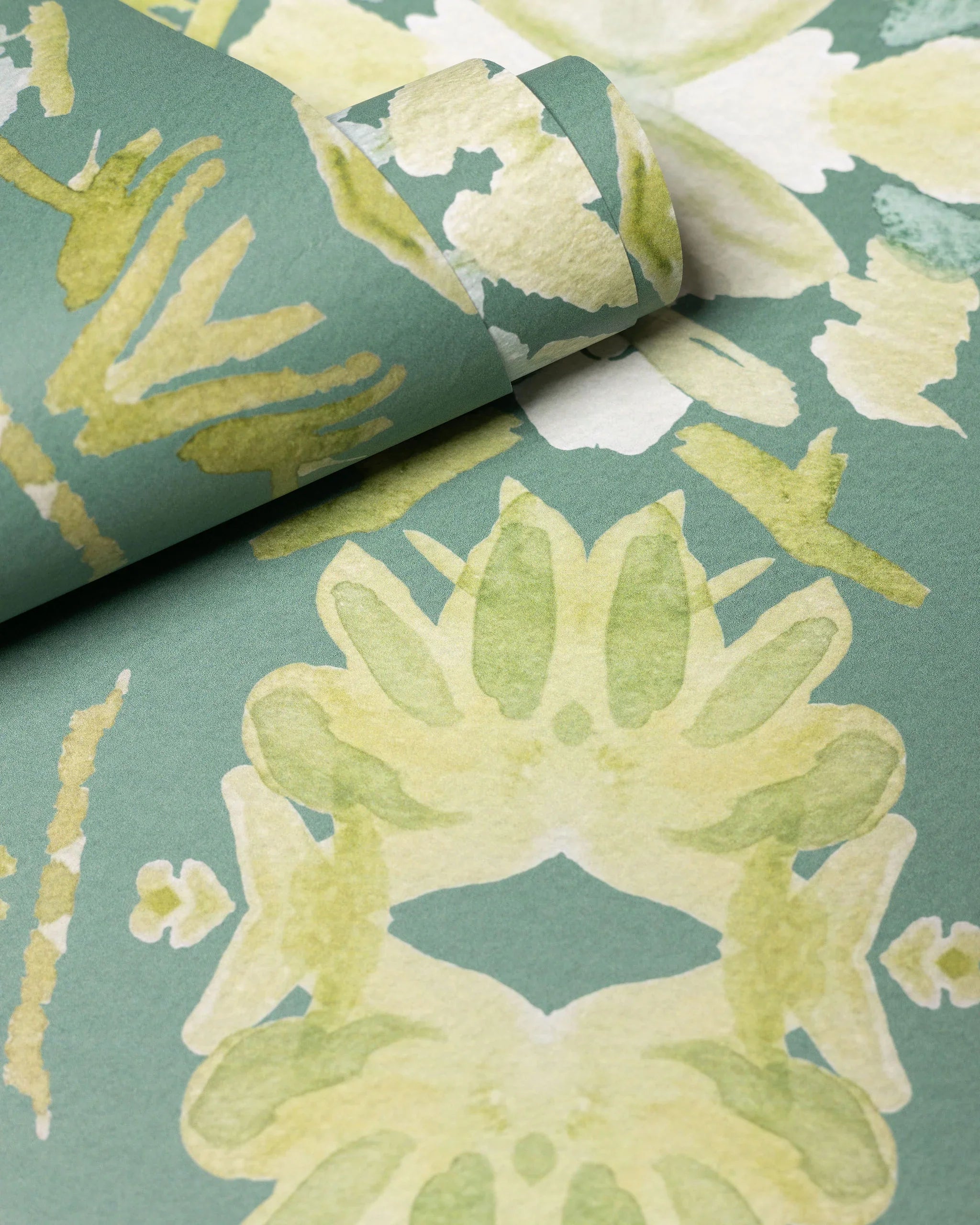 Luxury abstract floral wallpaper in rich dark green tones with layered organic movement, designed for modern traditional and collected interiors.