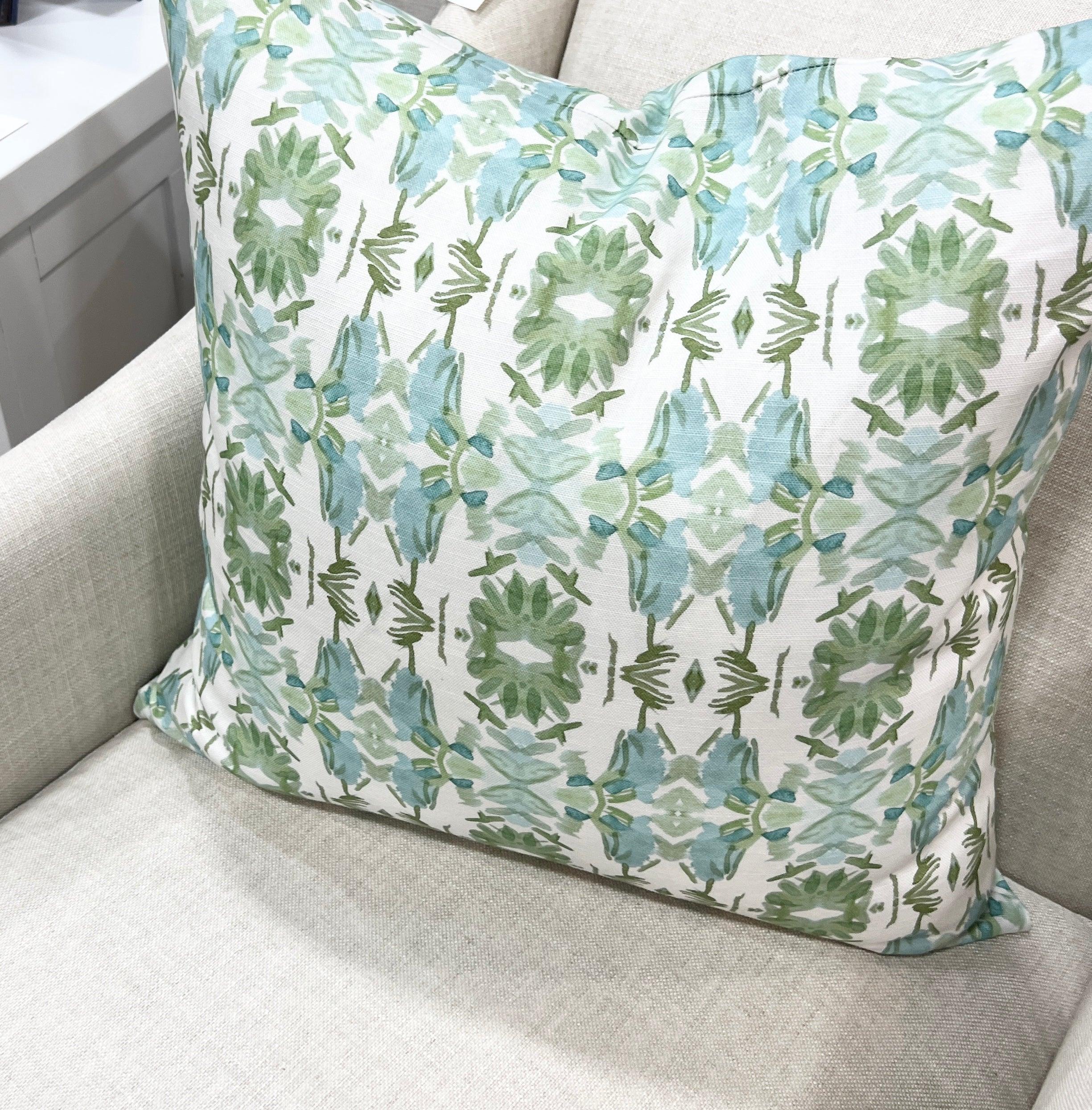 Luxury sage green and powder blue botanical pillow with large-scale floral pattern inspired by Alaska wildflowers, handcrafted in England and styled for contemporary and traditional interiors.