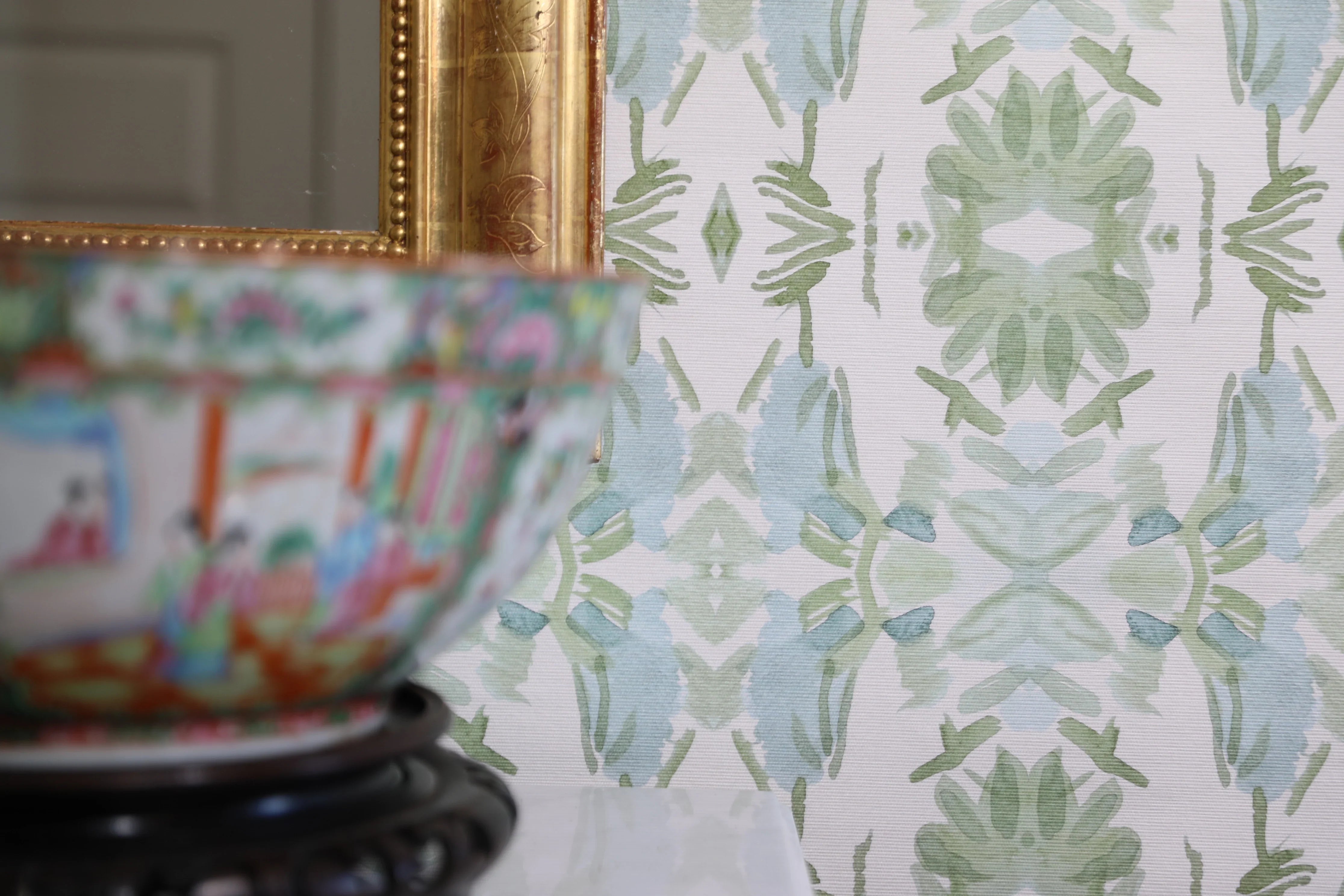 Luxury botanical wallpaper featuring an artistic wildflower-inspired pattern in sage green and soft blue, designed for modern traditional interiors, powder rooms, bedrooms, dining rooms, and collected homes.