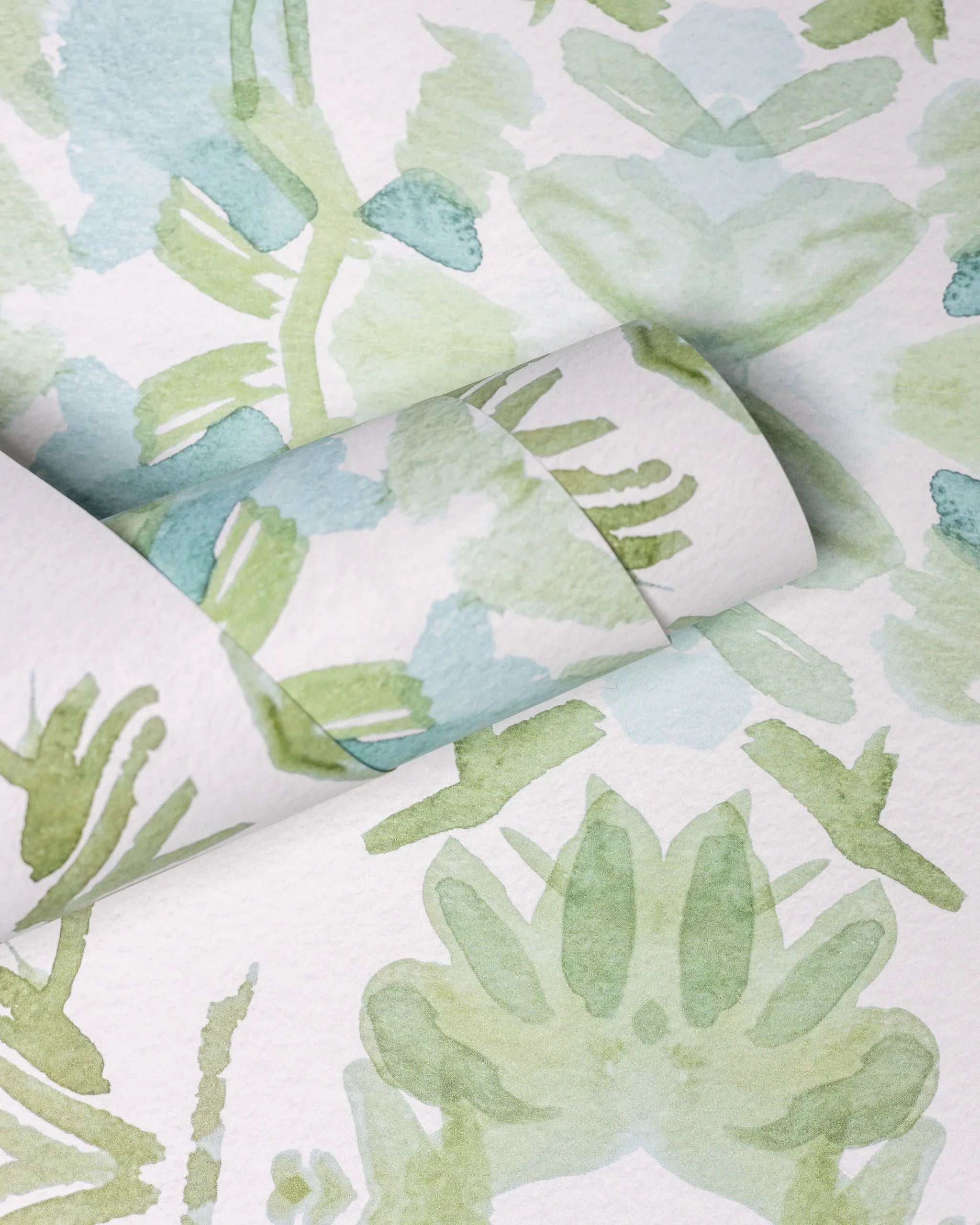 Luxury botanical wallpaper featuring an artistic wildflower-inspired pattern in sage green and soft blue, designed for modern traditional interiors, powder rooms, bedrooms, dining rooms, and collected homes.