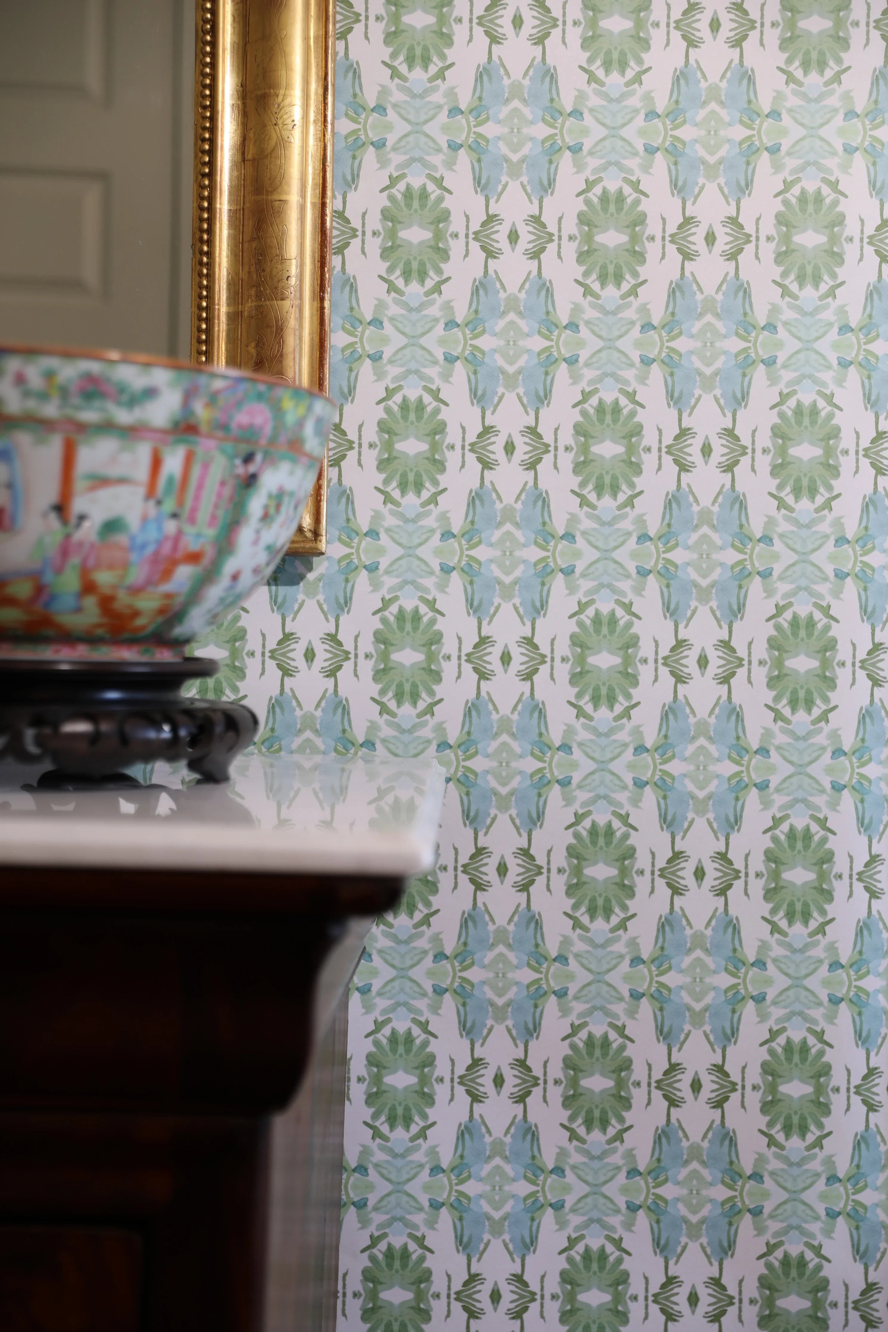 Luxury botanical wallpaper featuring an artistic wildflower-inspired pattern in sage green and soft blue, designed for modern traditional interiors, powder rooms, bedrooms, dining rooms, and collected homes.