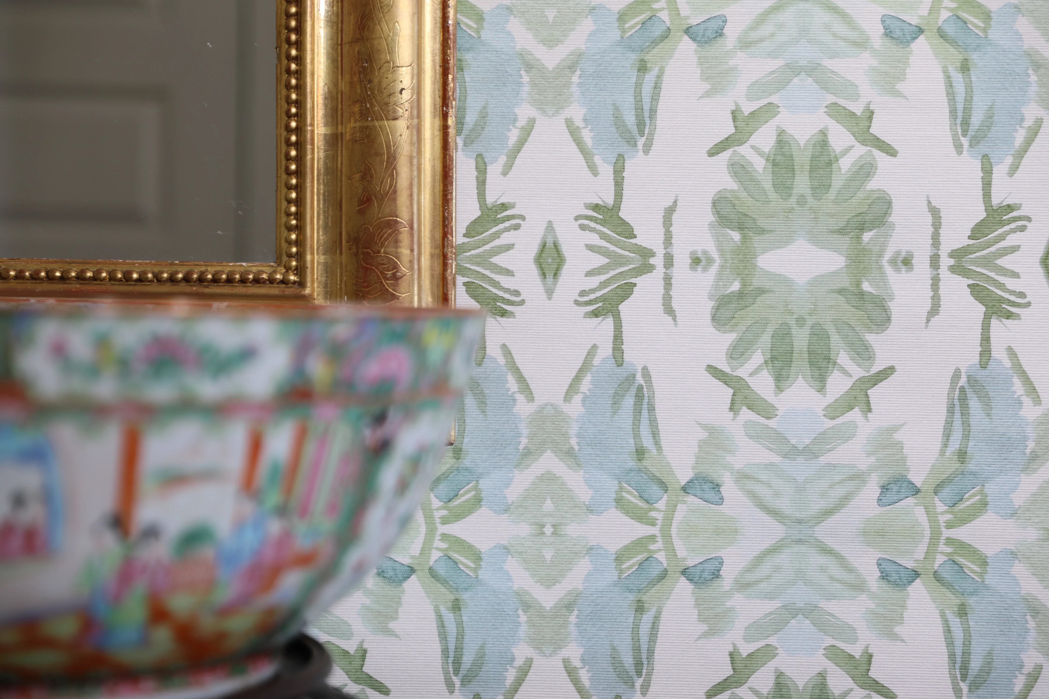 Luxury botanical wallpaper featuring an artistic wildflower-inspired pattern in sage green and soft blue, designed for modern traditional interiors, powder rooms, bedrooms, dining rooms, and collected homes.