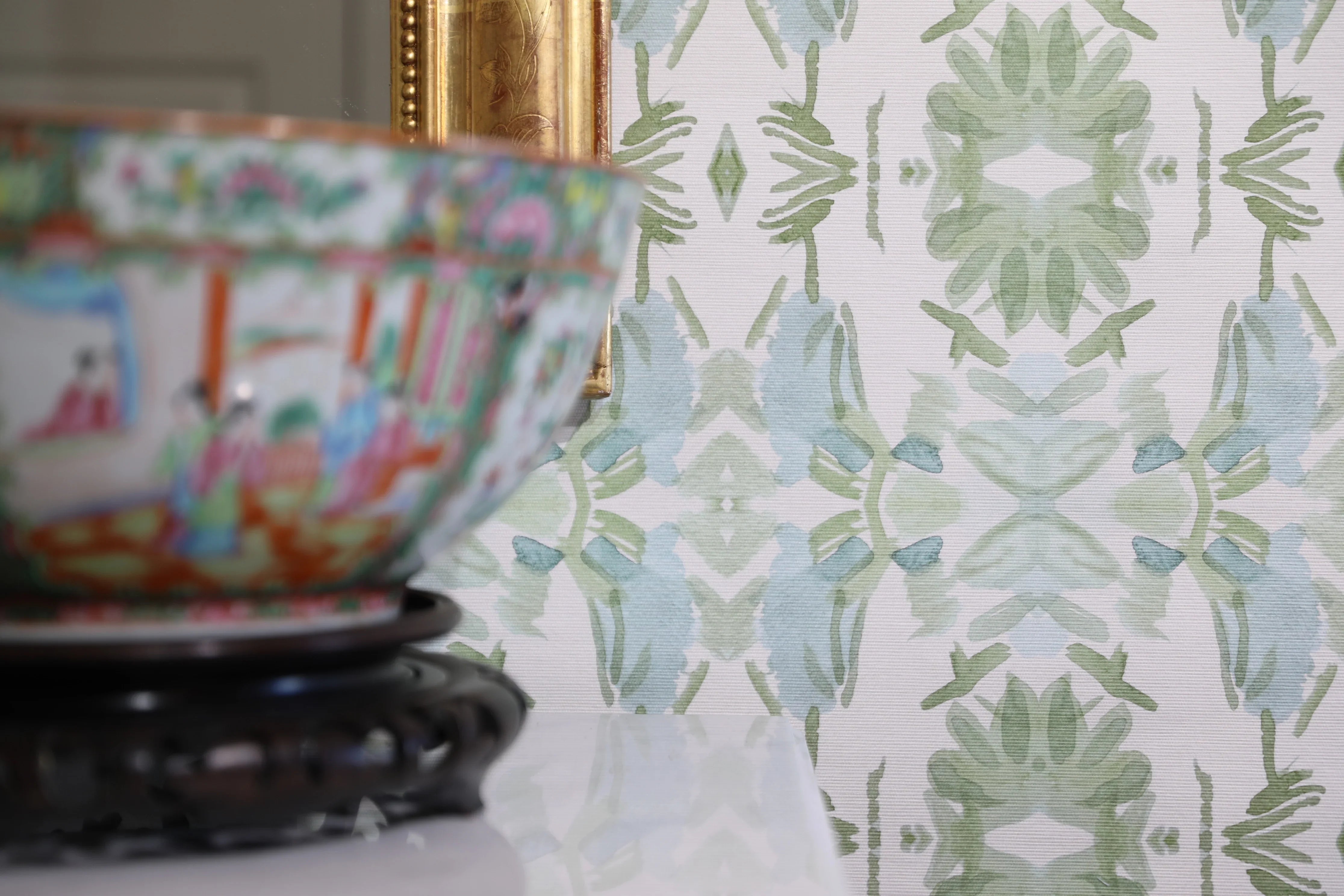 Luxury botanical wallpaper featuring an artistic wildflower-inspired pattern in sage green and soft blue, designed for modern traditional interiors, powder rooms, bedrooms, dining rooms, and collected homes.