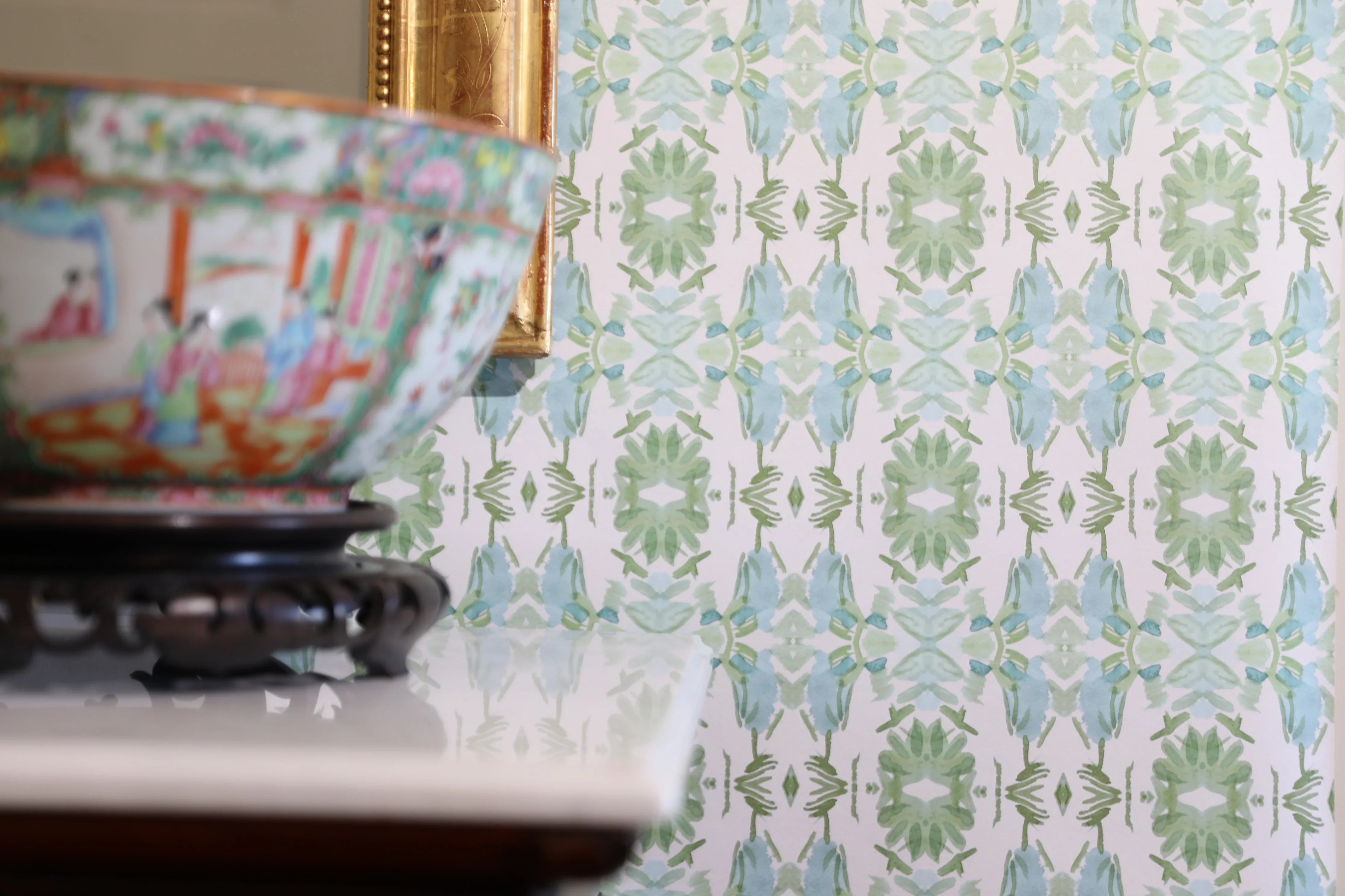 Luxury botanical wallpaper featuring an artistic wildflower-inspired pattern in sage green and soft blue, designed for modern traditional interiors, powder rooms, bedrooms, dining rooms, and collected homes.