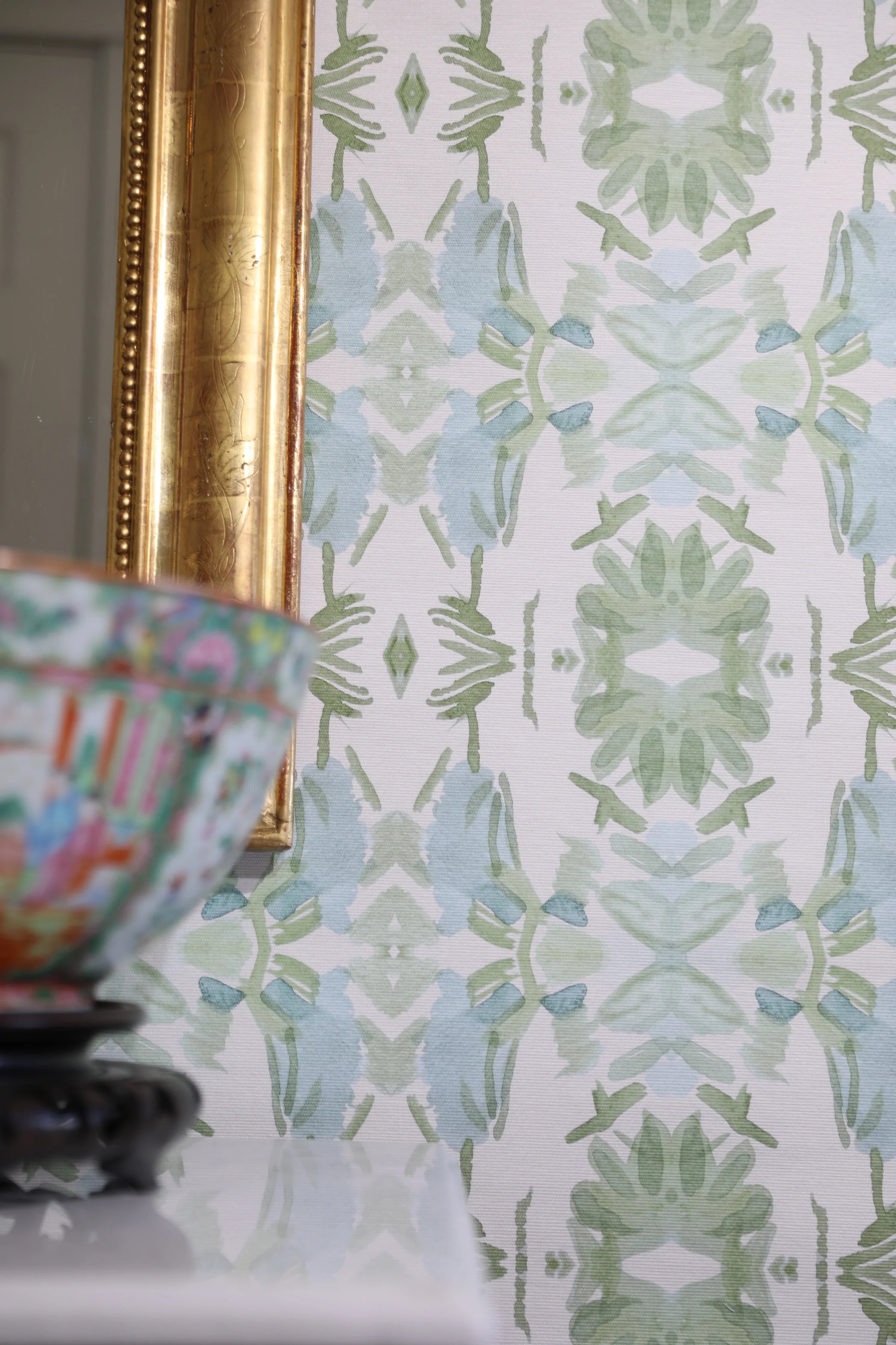 Luxury botanical wallpaper featuring an artistic wildflower-inspired pattern in sage green and soft blue, designed for modern traditional interiors, powder rooms, bedrooms, dining rooms, and collected homes.