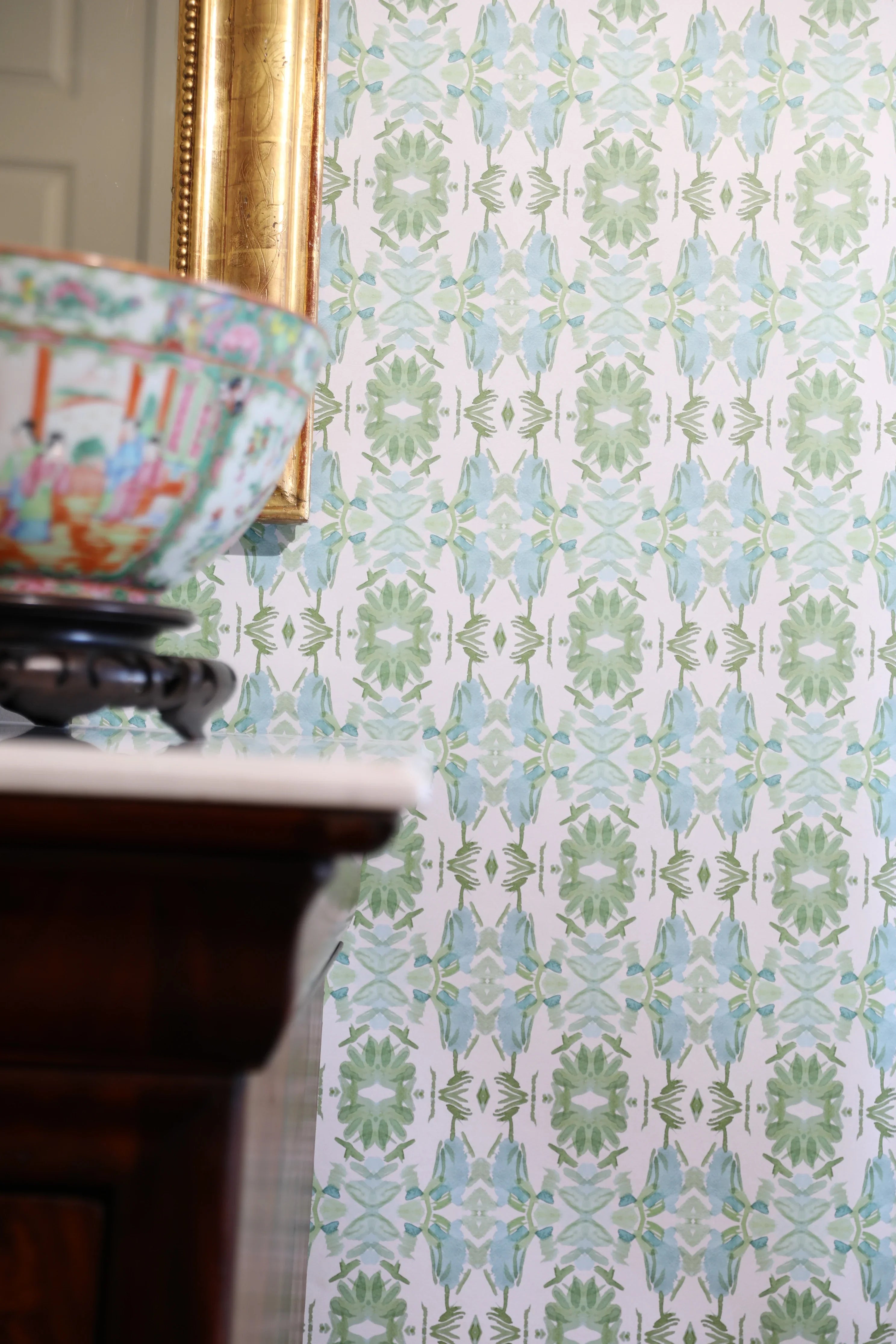 Luxury botanical wallpaper featuring an artistic wildflower-inspired pattern in sage green and soft blue, designed for modern traditional interiors, powder rooms, bedrooms, dining rooms, and collected homes.