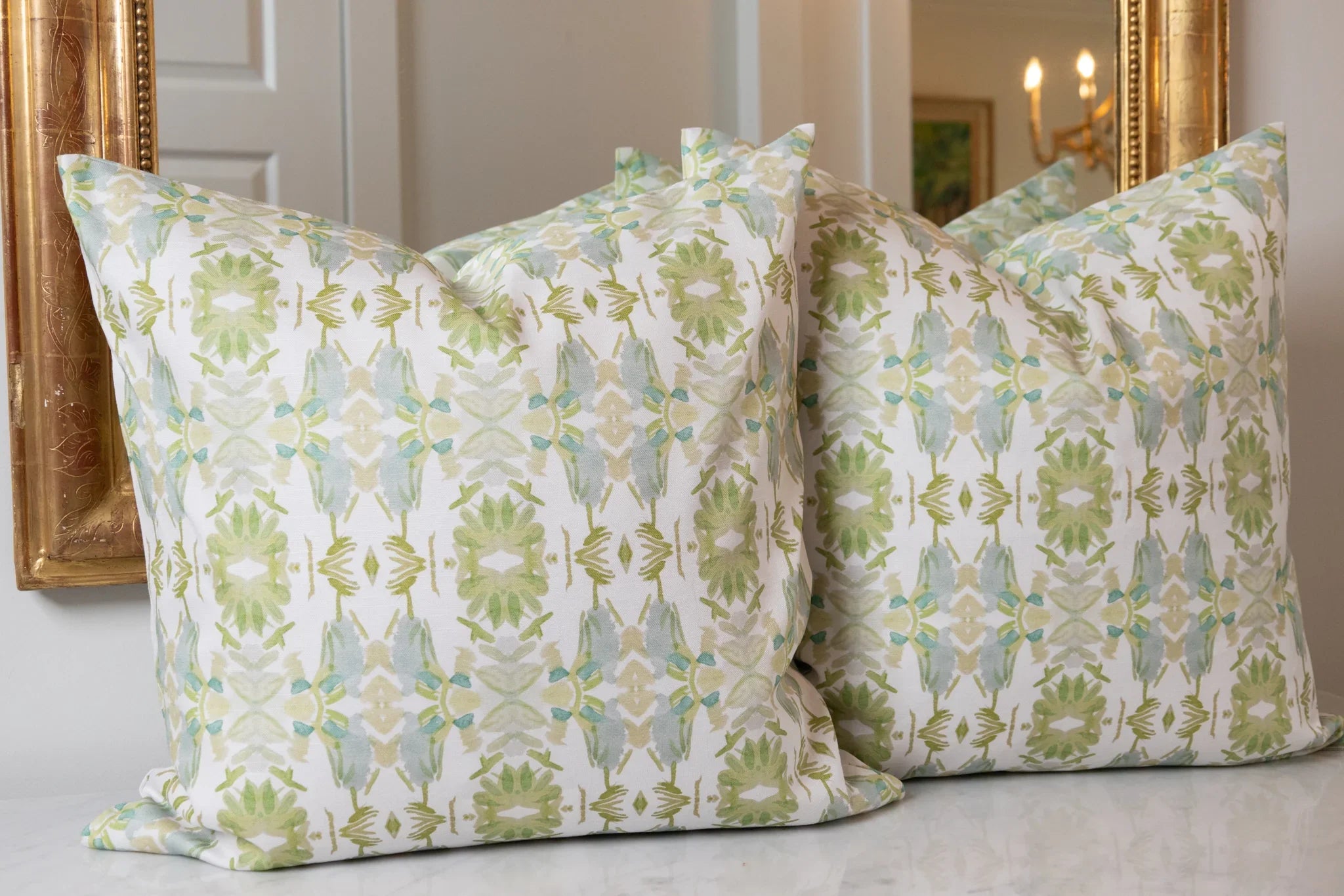 Wildflowers I White & Apple Green luxury pillow featuring an artistic floral pattern on a soft white ground, handcrafted in England for traditional, modern traditional, and layered interior design projects.