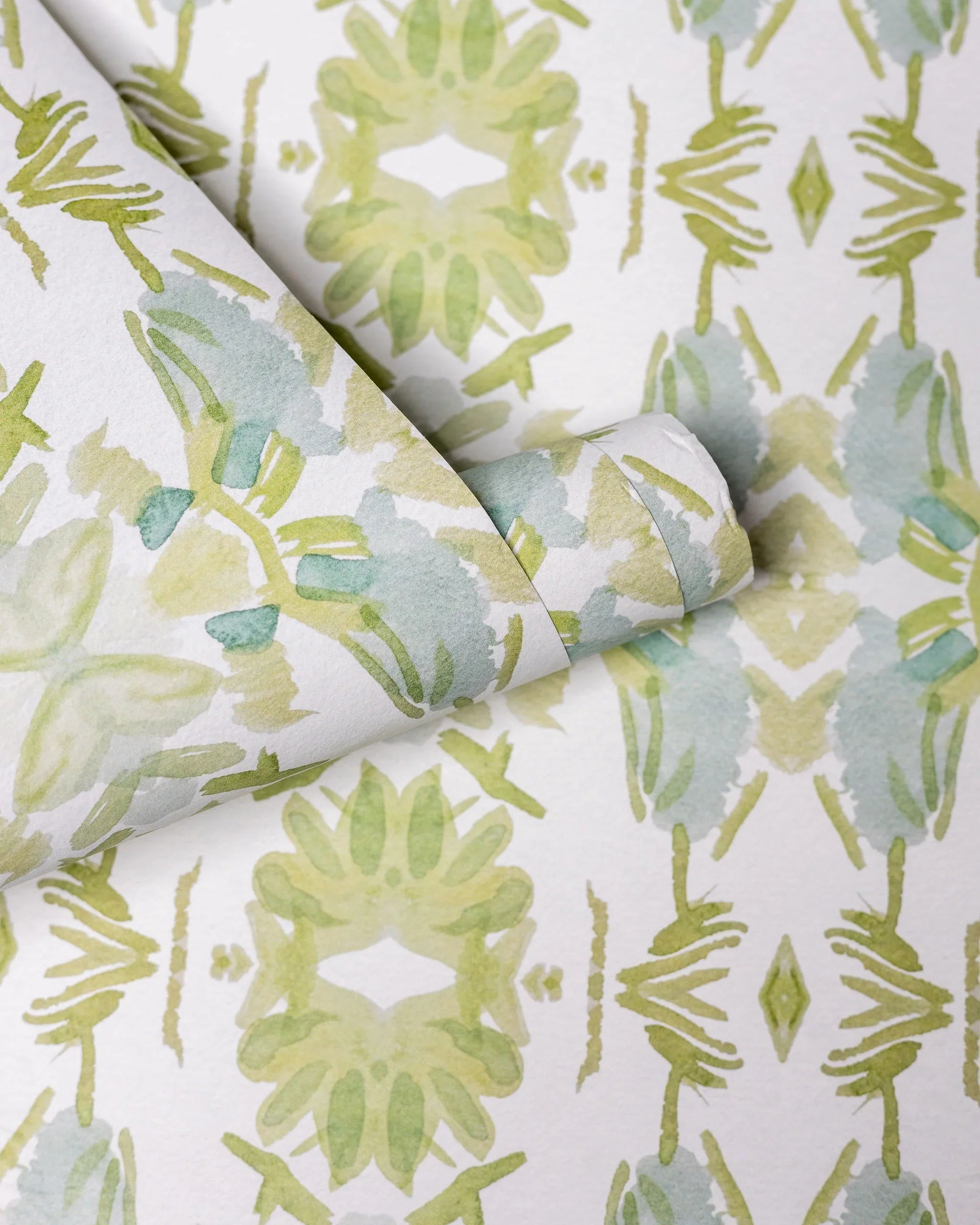 Wildflowers I White & Apple Green luxury wallpaper featuring an abstract floral pattern on a soft white ground with fresh apple green tones, sustainably printed in England for luxury homes, designer-curated interiors, powder rooms, bedrooms, and thoughtfully layered living spaces.